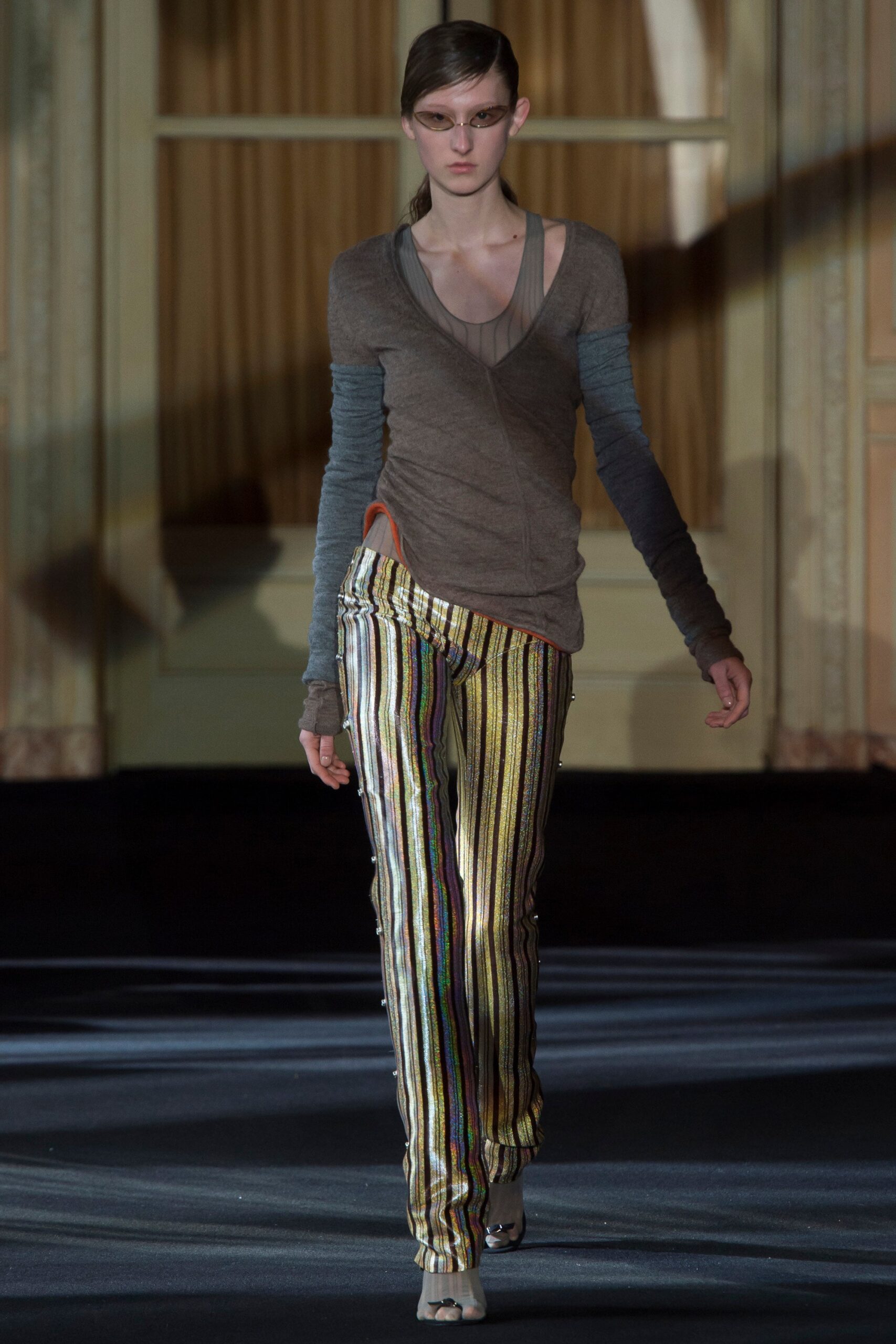 brown fitted top with multi-colored pants