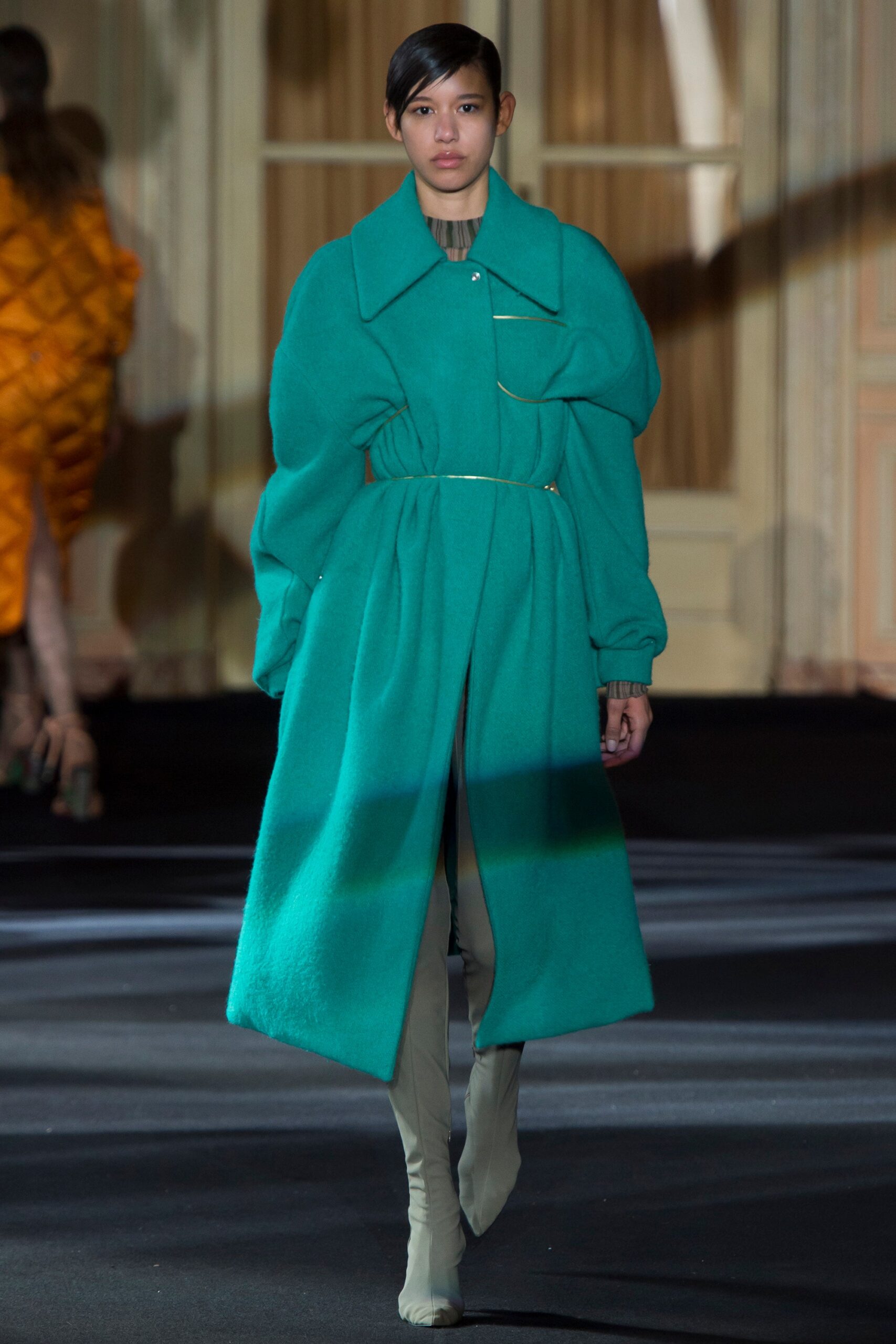 green wool coat with beige pants