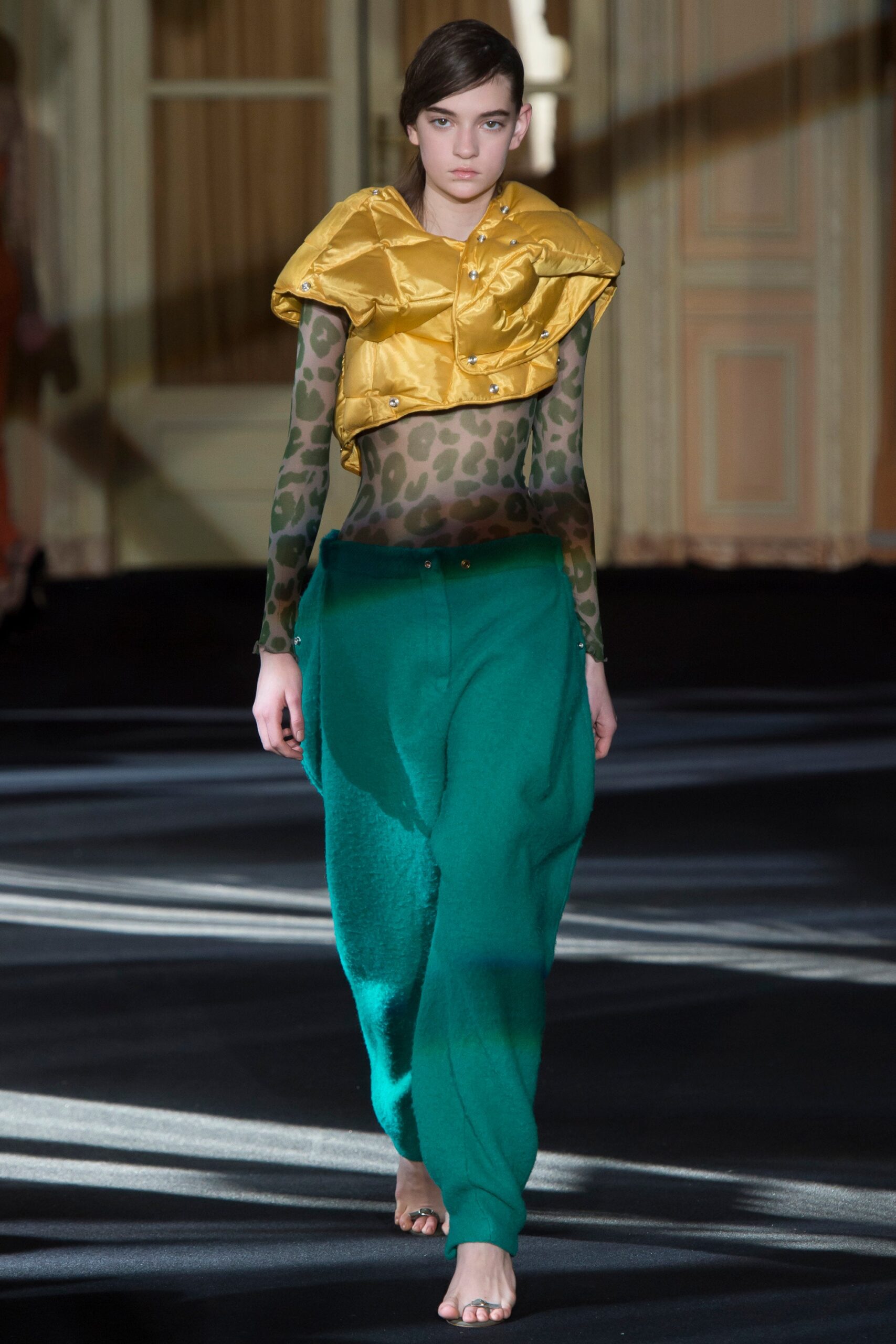 green animal-print top with yellow jacket