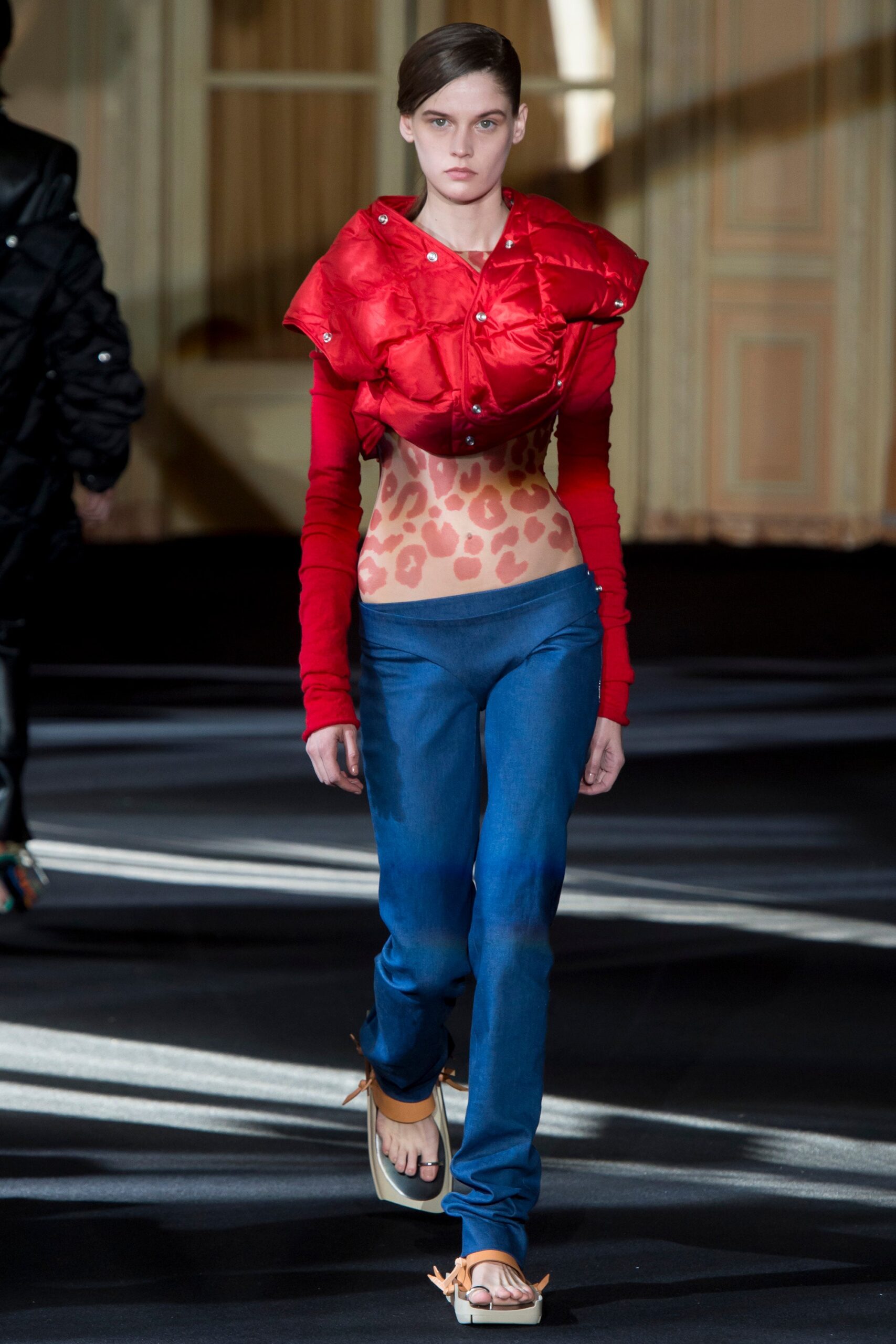 red silk fitted top and blue denim pants
