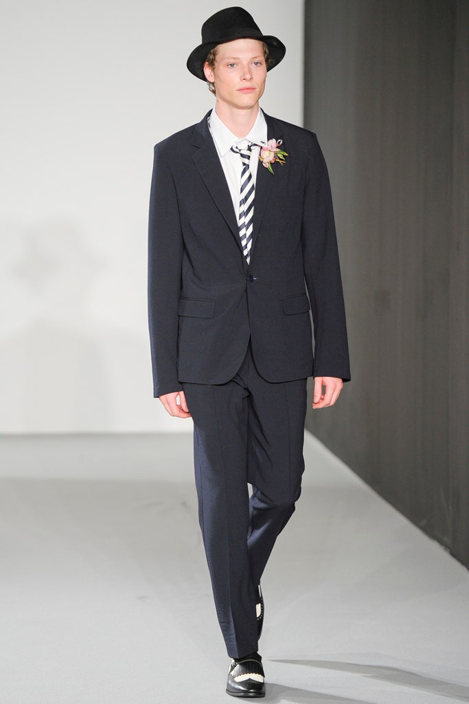 navy tailored suit with hat