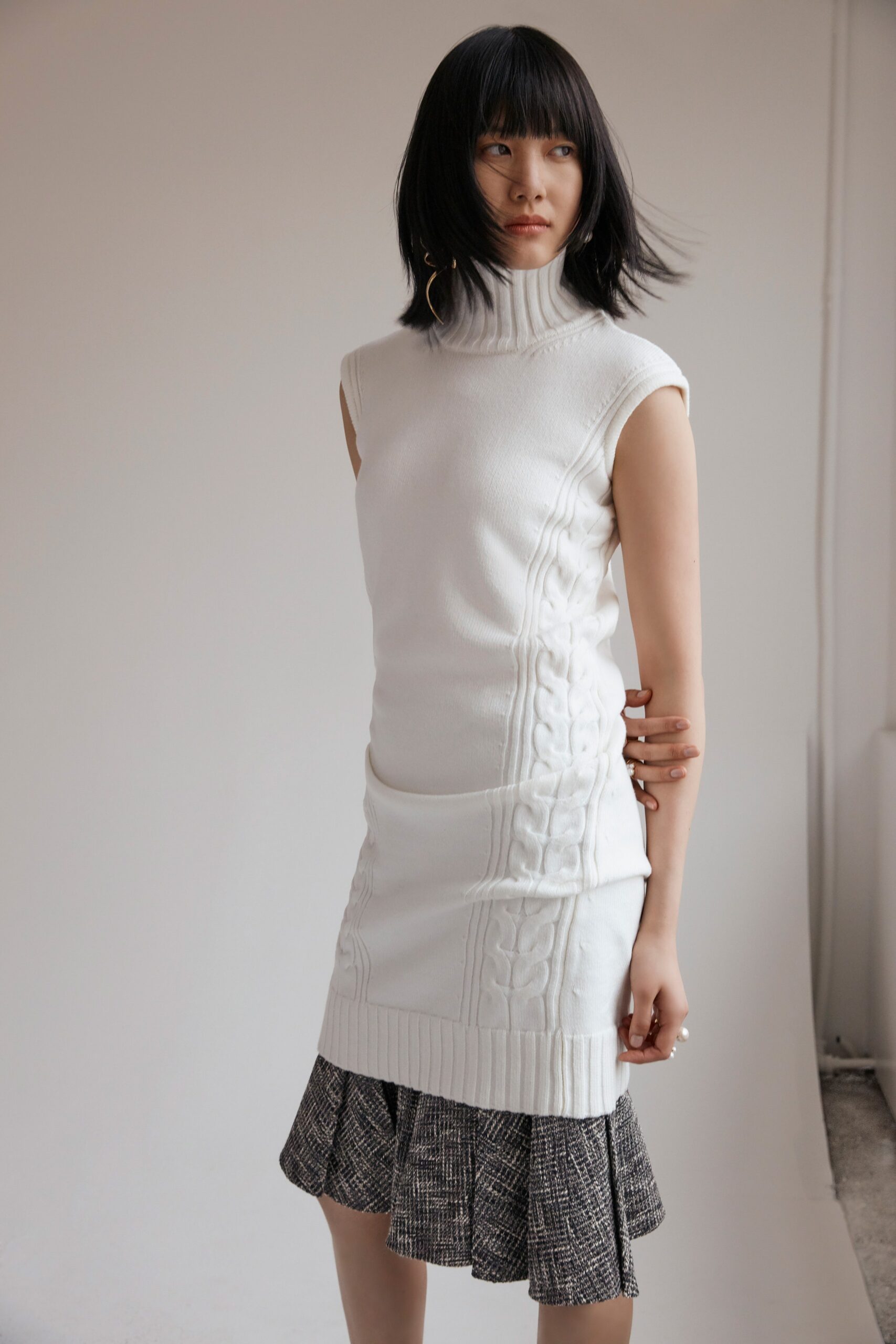 white fitted mini dress with pleated skirt