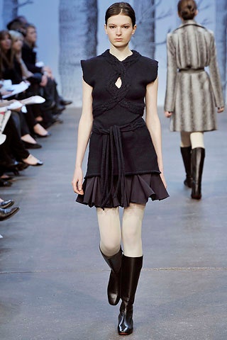 black fitted mini dress with boots
