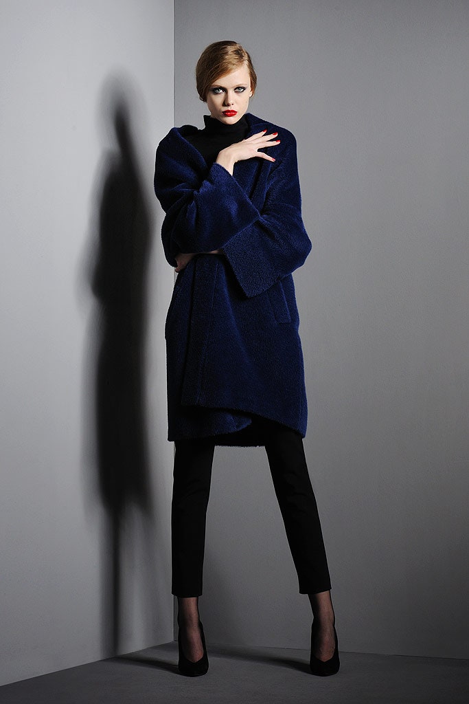 blue faux-fur coat with black pants