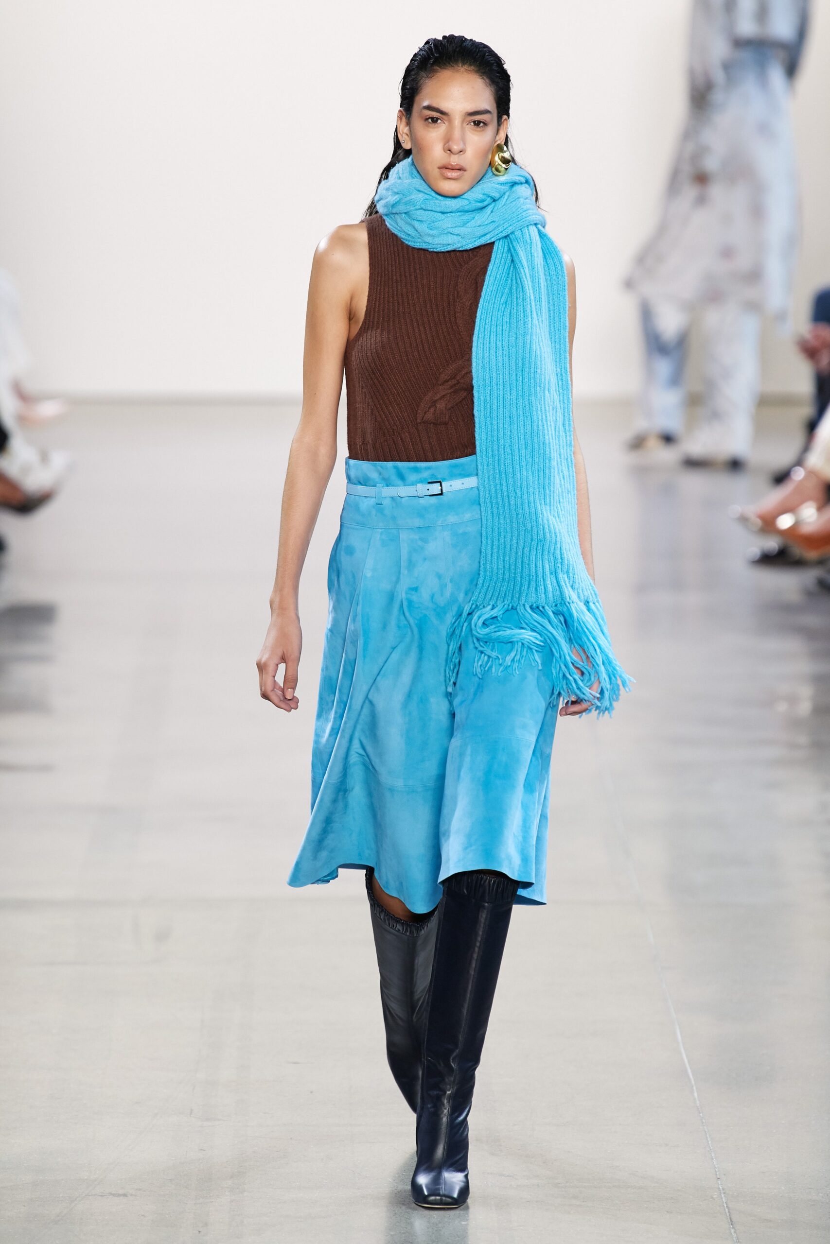 brown fitted top with blue skirt