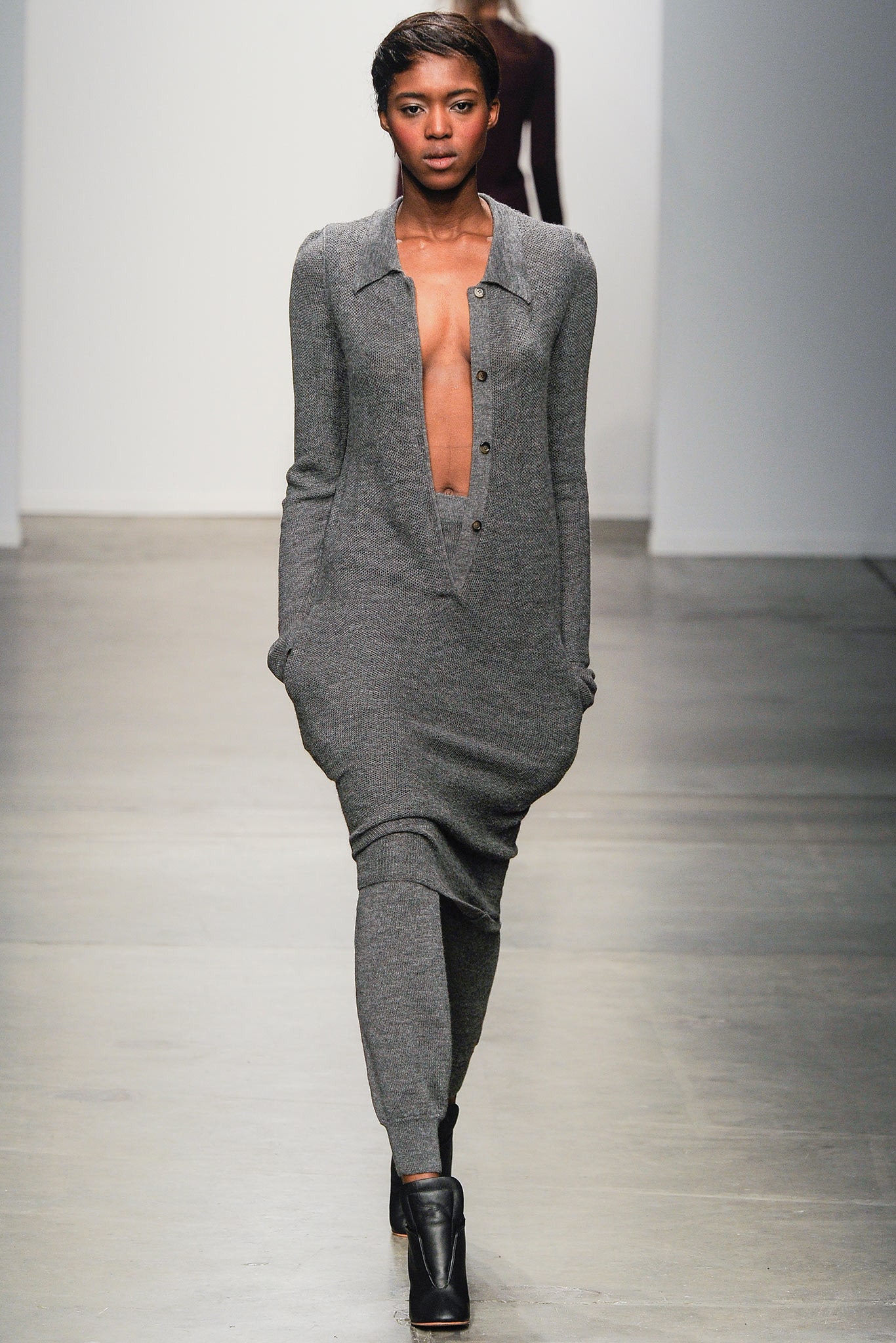 A relaxed gray wool dress with a collared neckline and buttoned front.