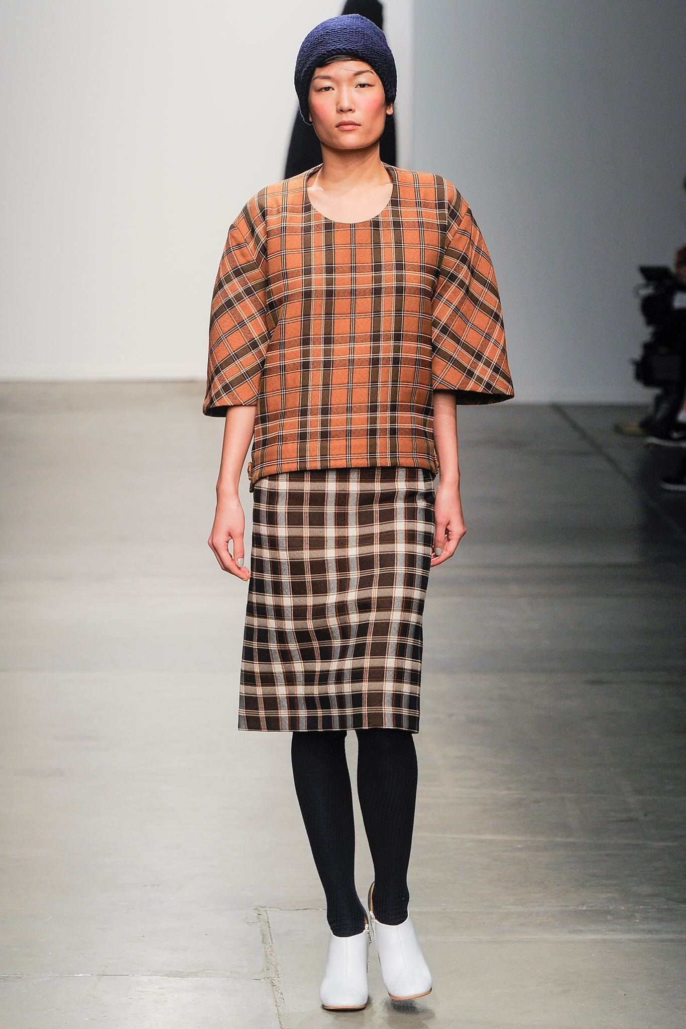 A relaxed brown and beige checked top paired with a matching skirt.