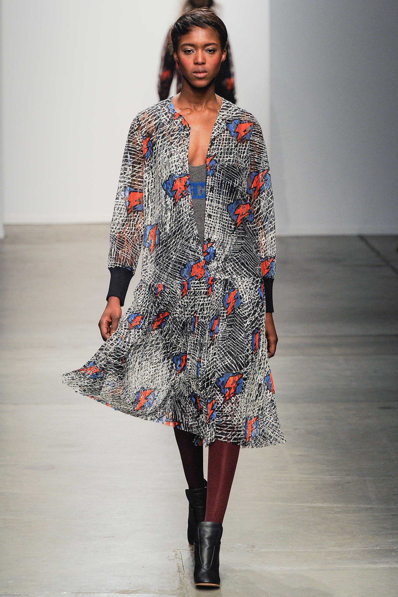 A relaxed multicolor printed silk dress with long sleeves and a collared neckline.