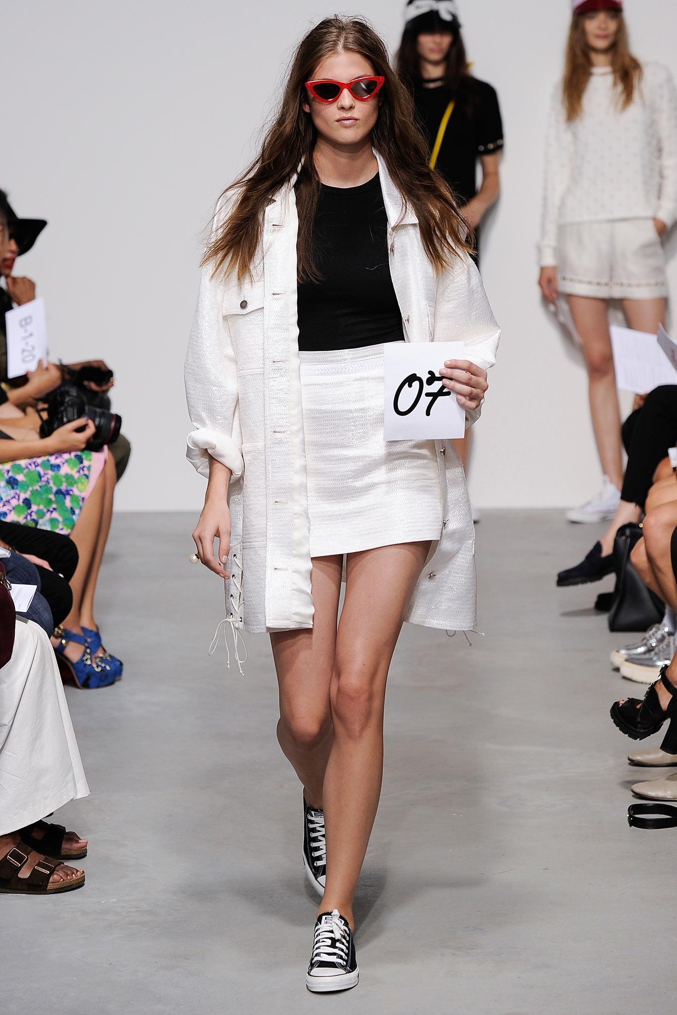 white jacket black top mini skirt