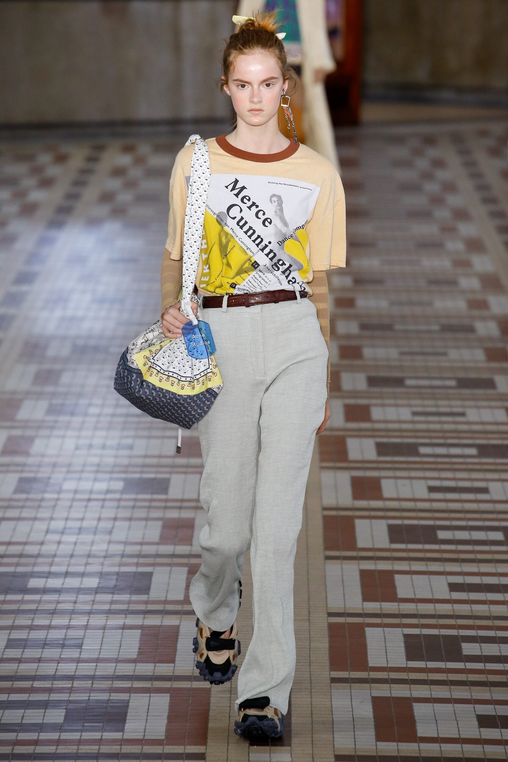 beige printed t-shirt and gray pants