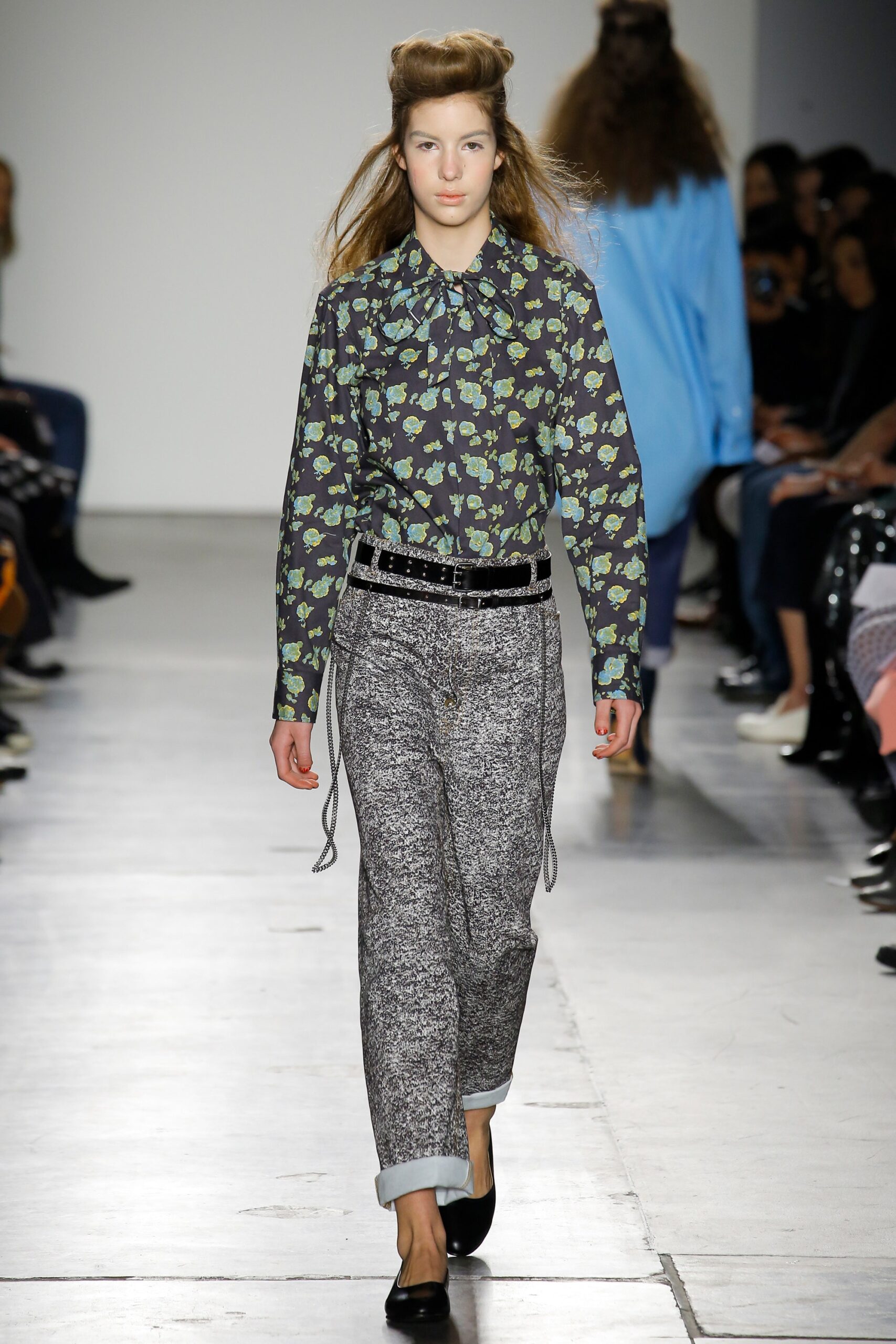 A relaxed-fit long-sleeve collared shirt with a printed pattern paired with wide-leg pants.