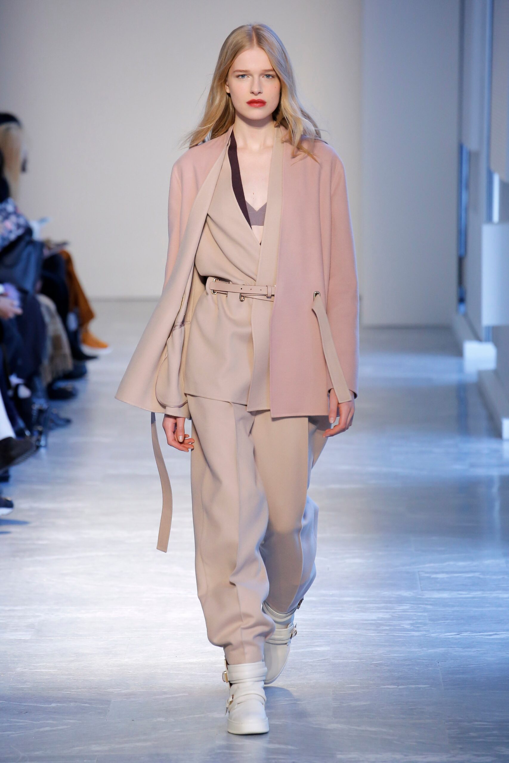 pink tailored blazer with beige pants