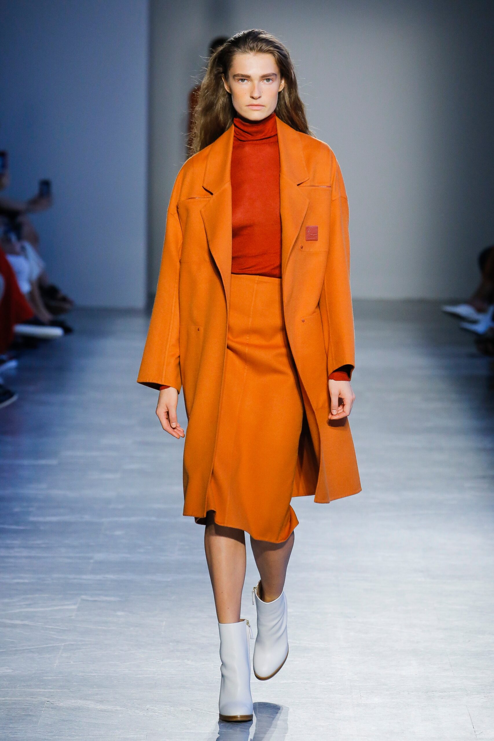 orange coat red turtleneck outfit