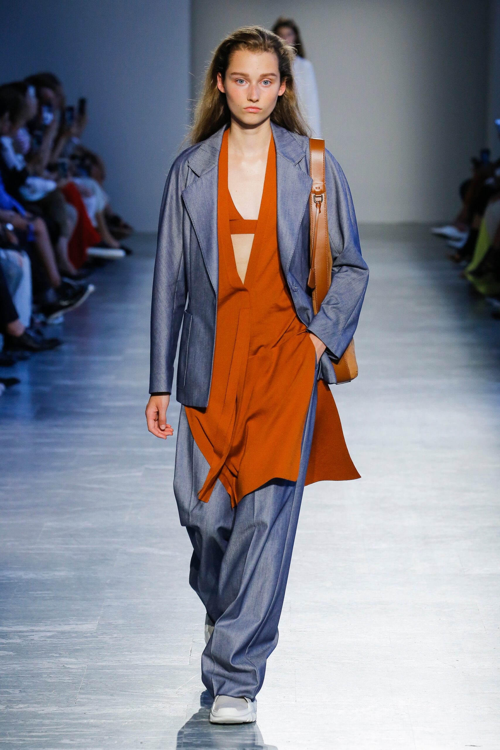 blue denim jacket with orange jumpsuit