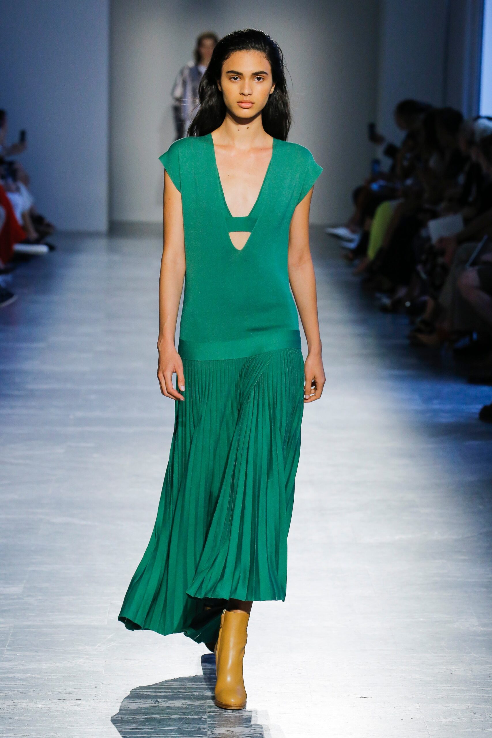 green pleated midi dress with brown boots