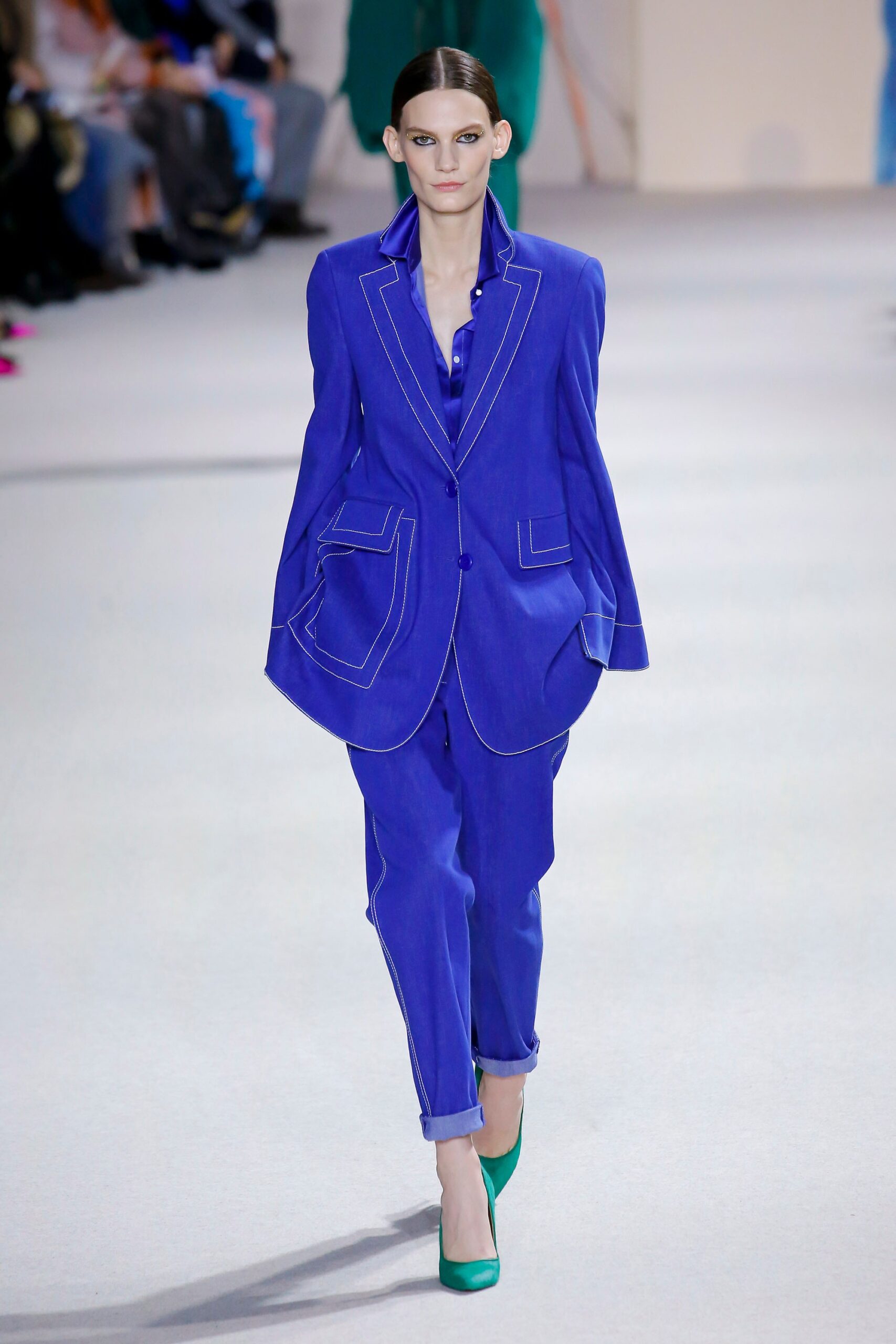 blue relaxed suit with green shoes