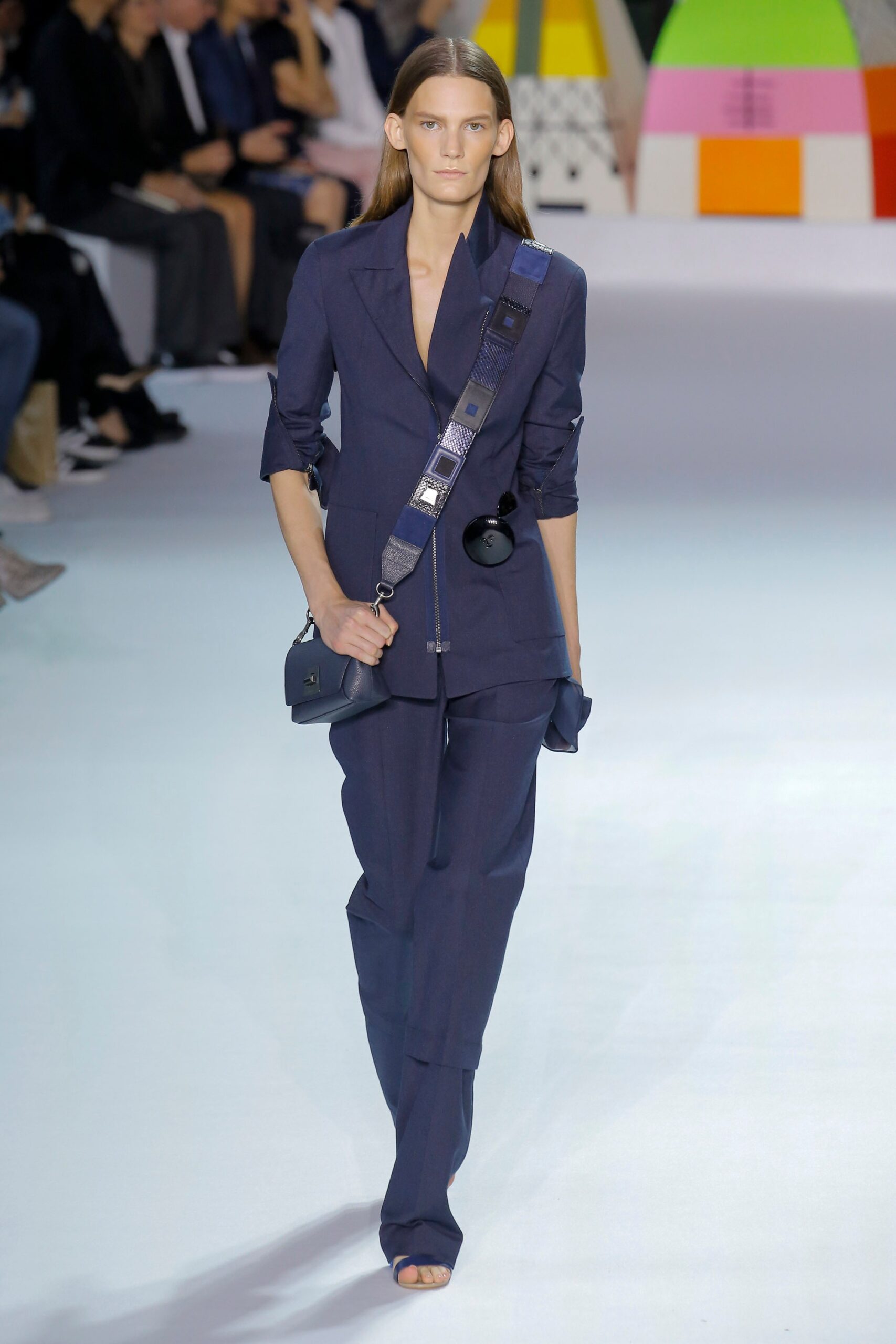 blue tailored suit with bag
