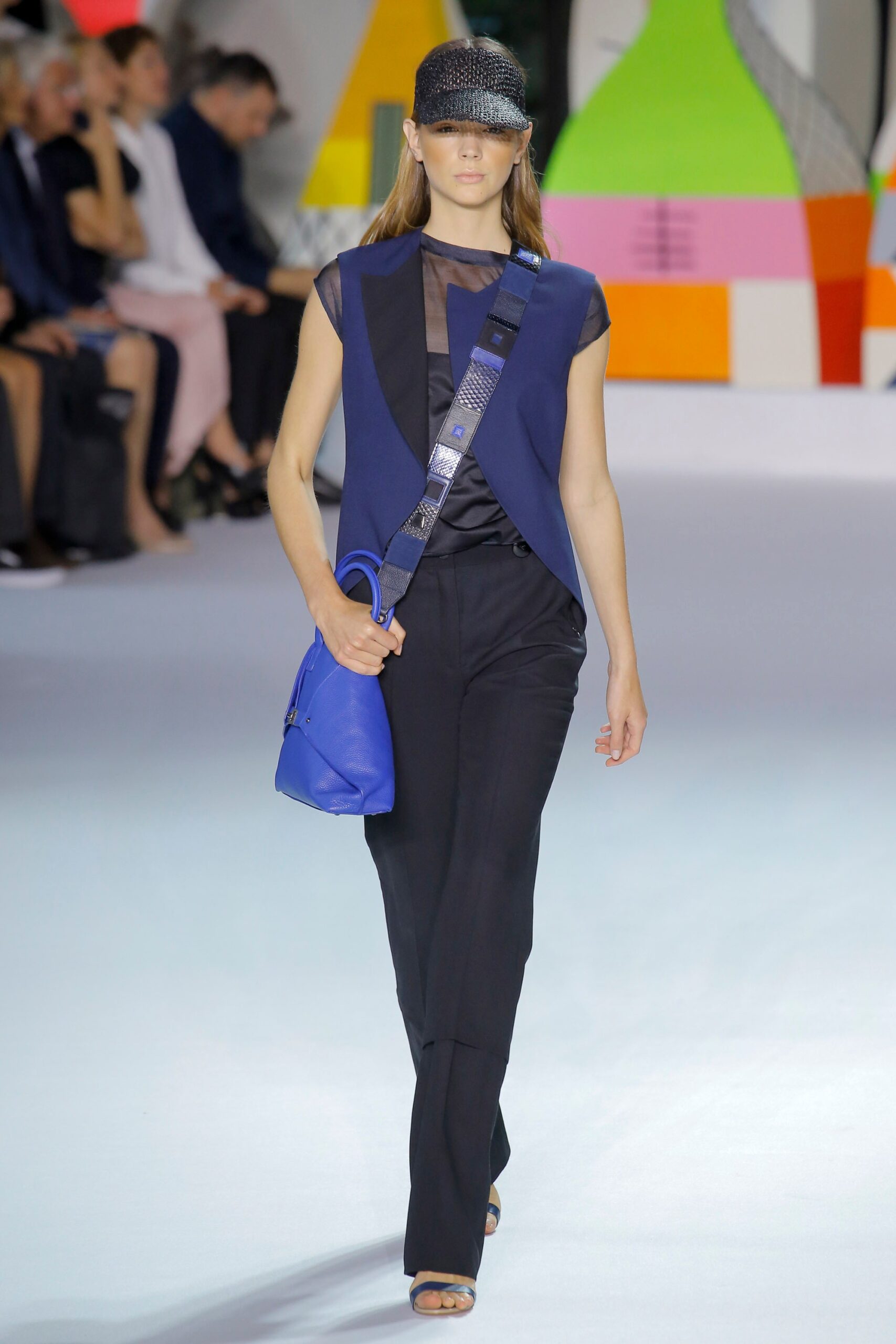 blue fitted top with black pants