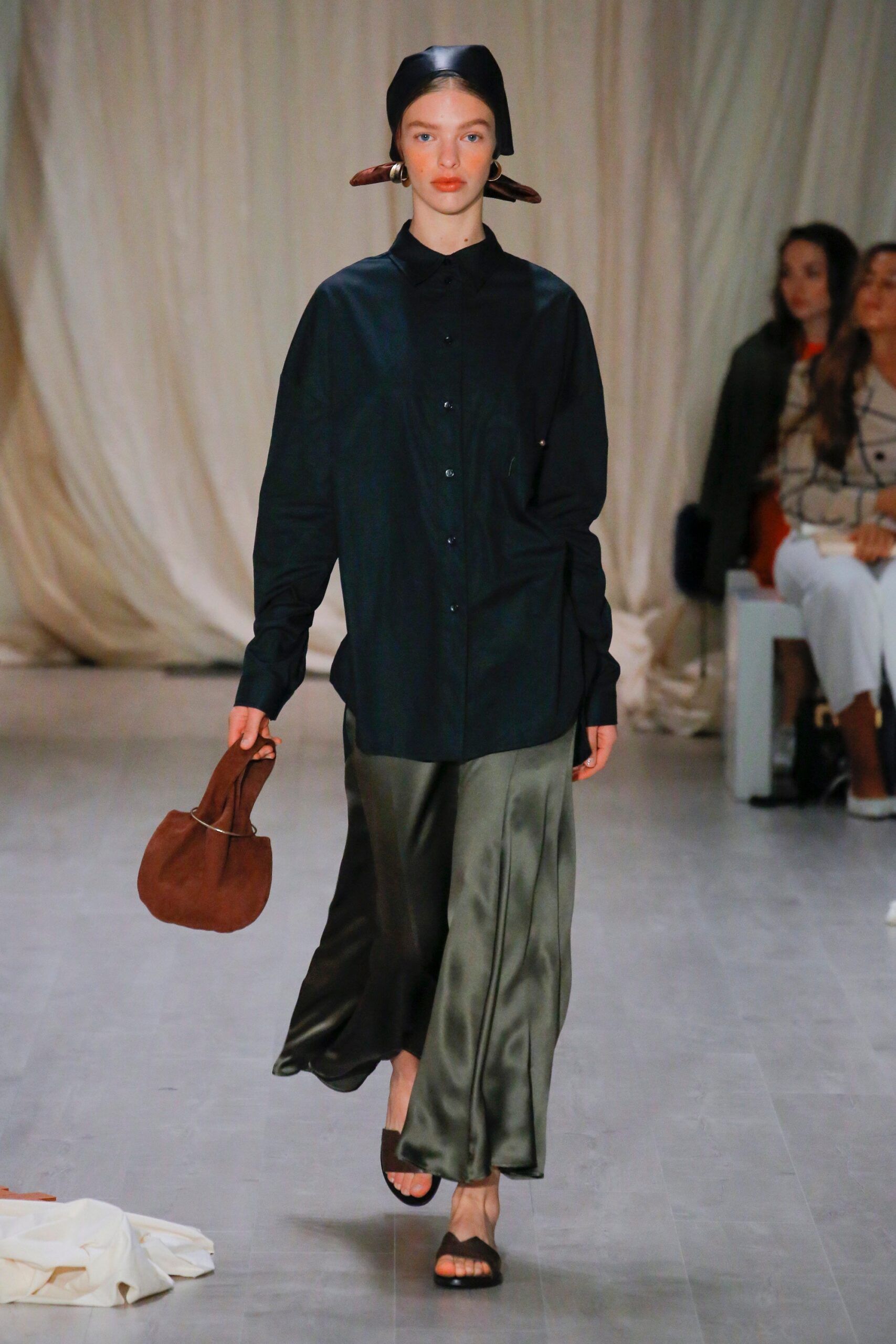 black shirt green flowing skirt