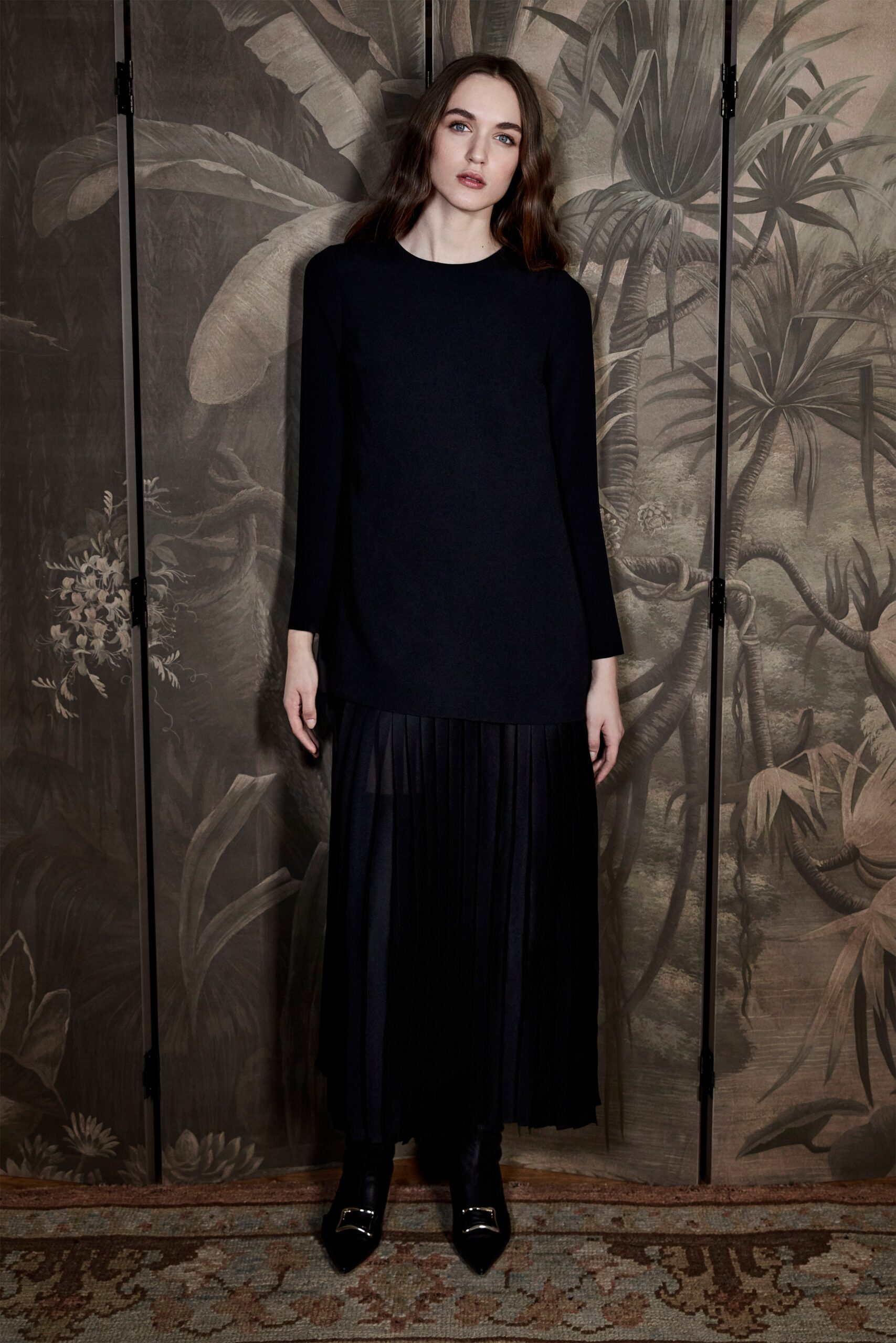 black relaxed top and pleated midi skirt