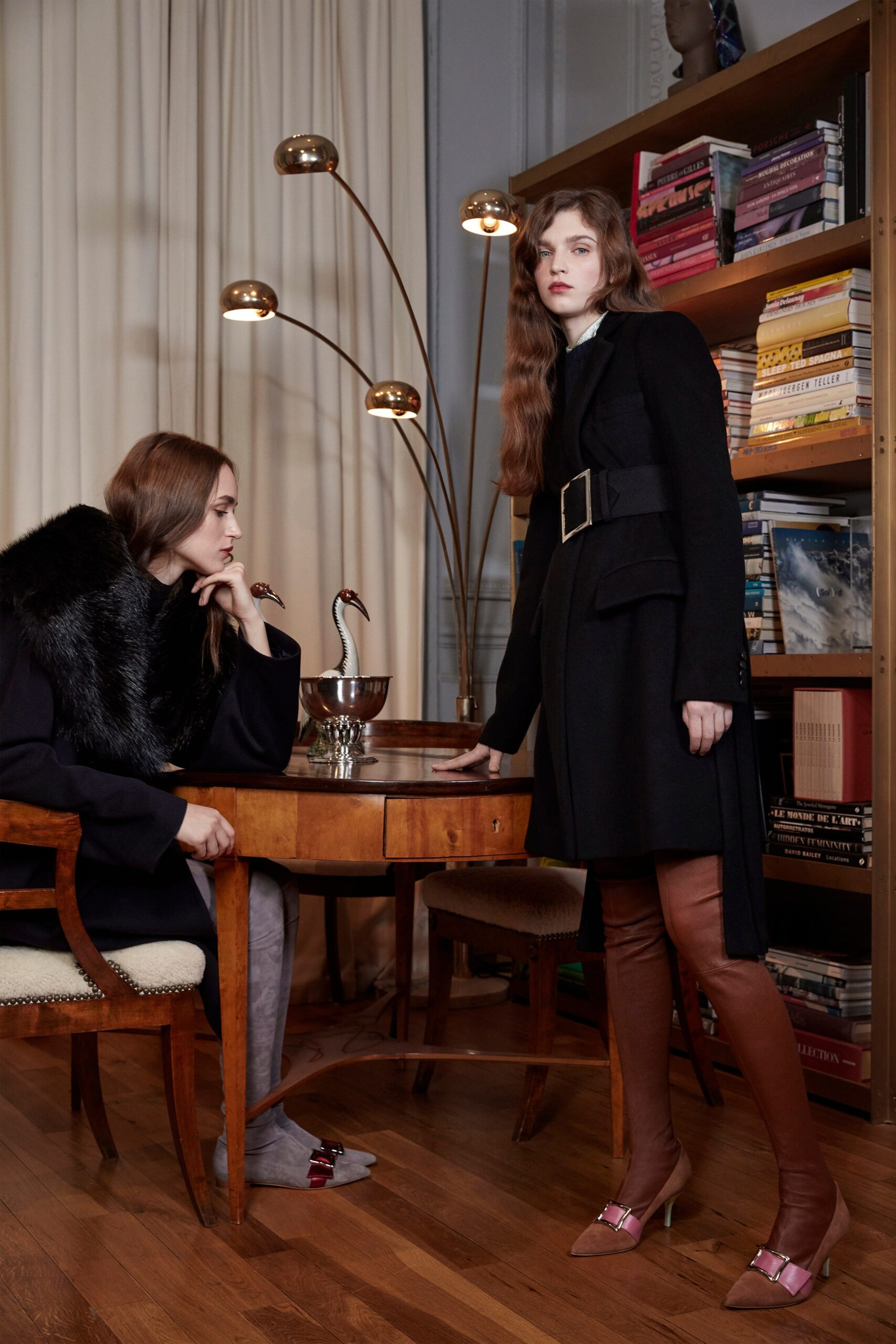black wool coat with brown leather pants