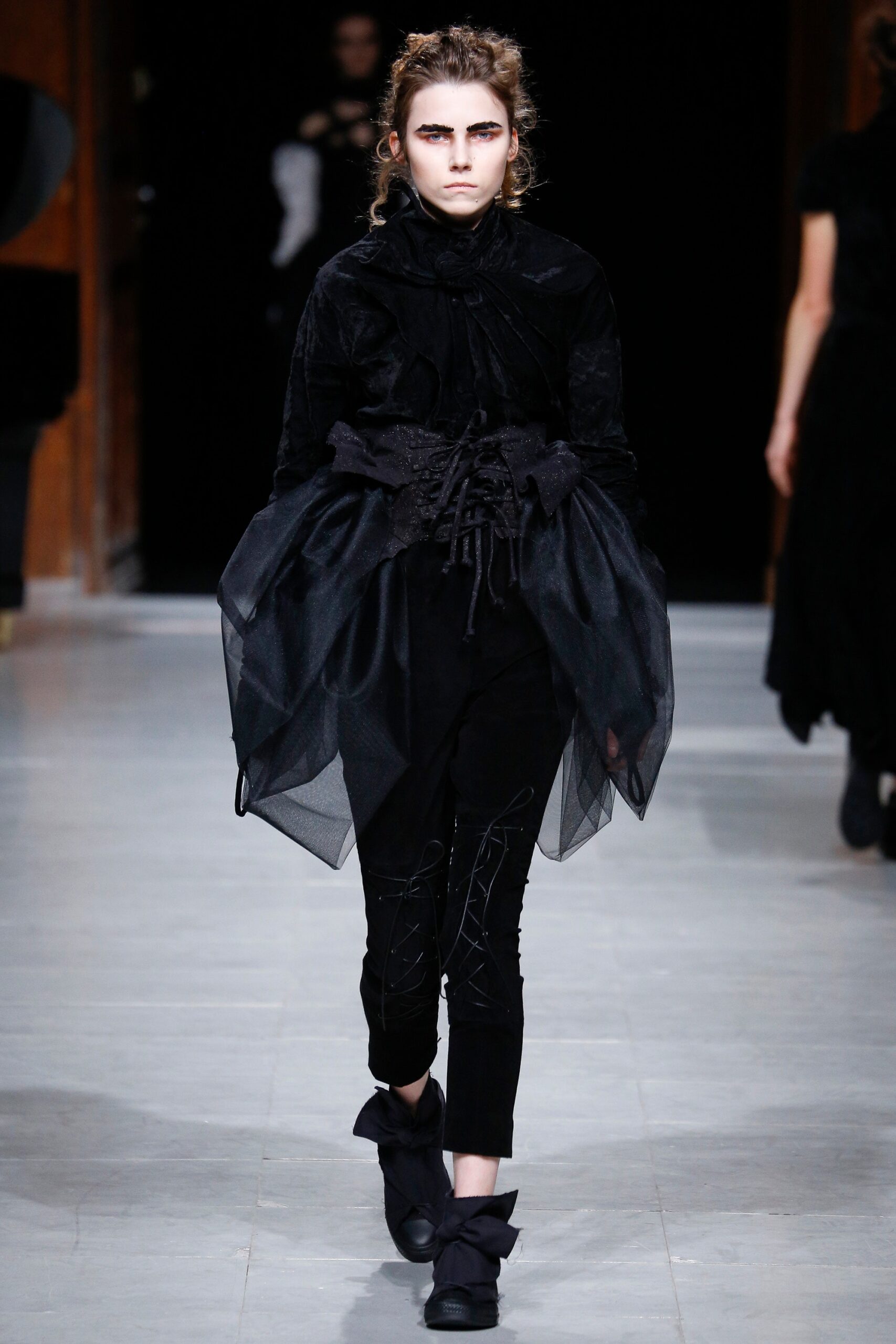 black fitted top and slim pants