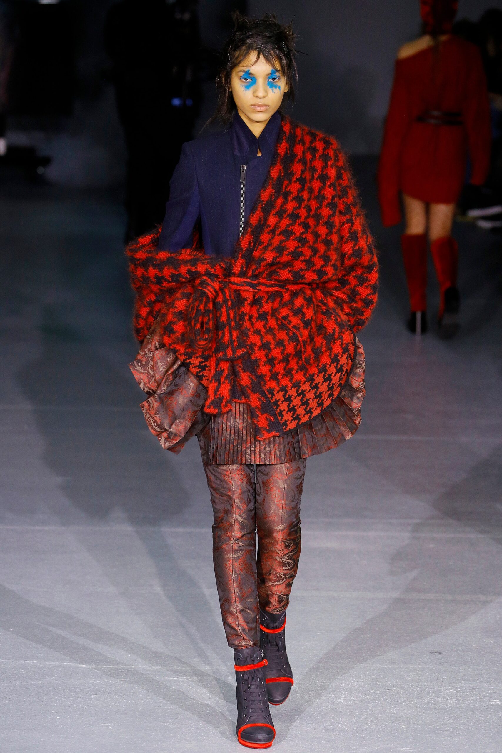 layered red and black coat with pleated skirt