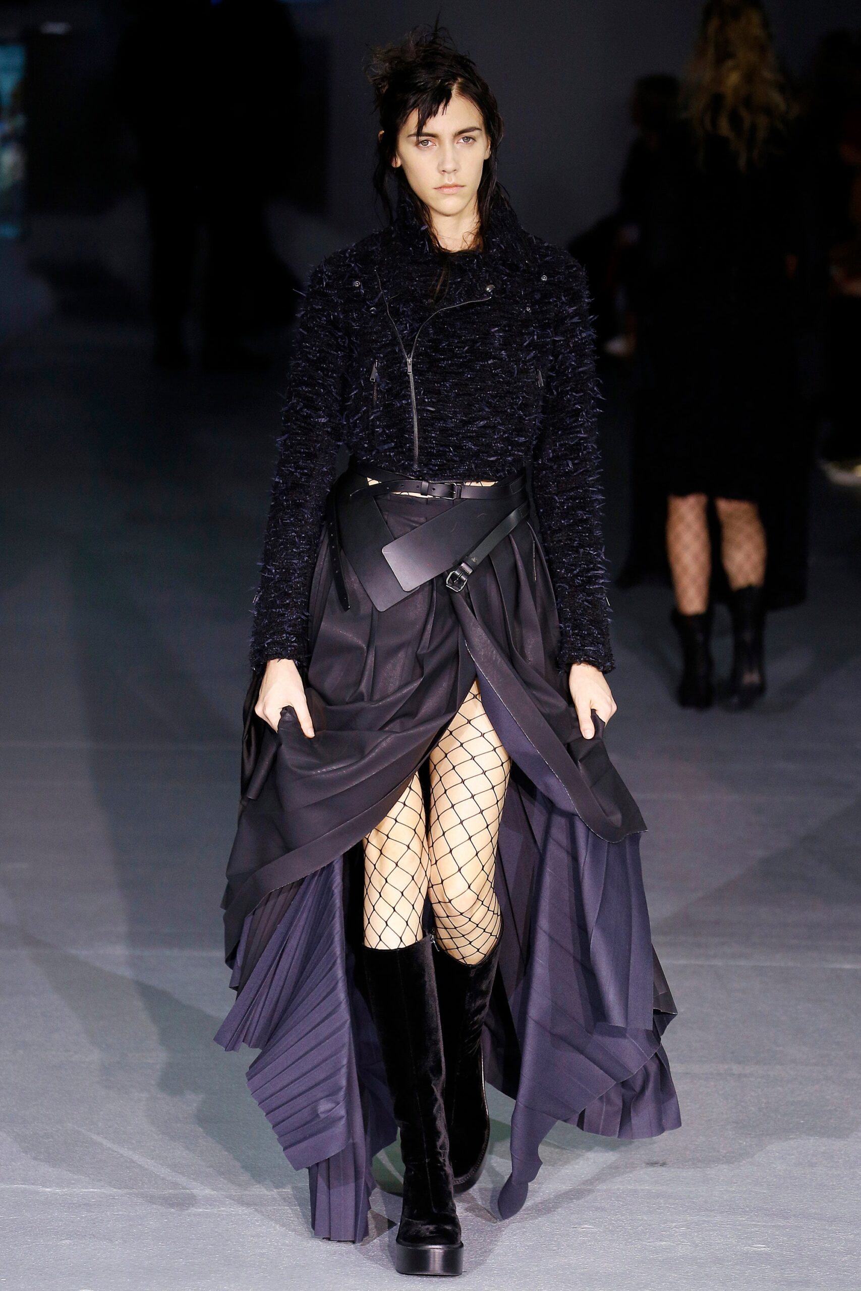 black wool coat with pleated skirt