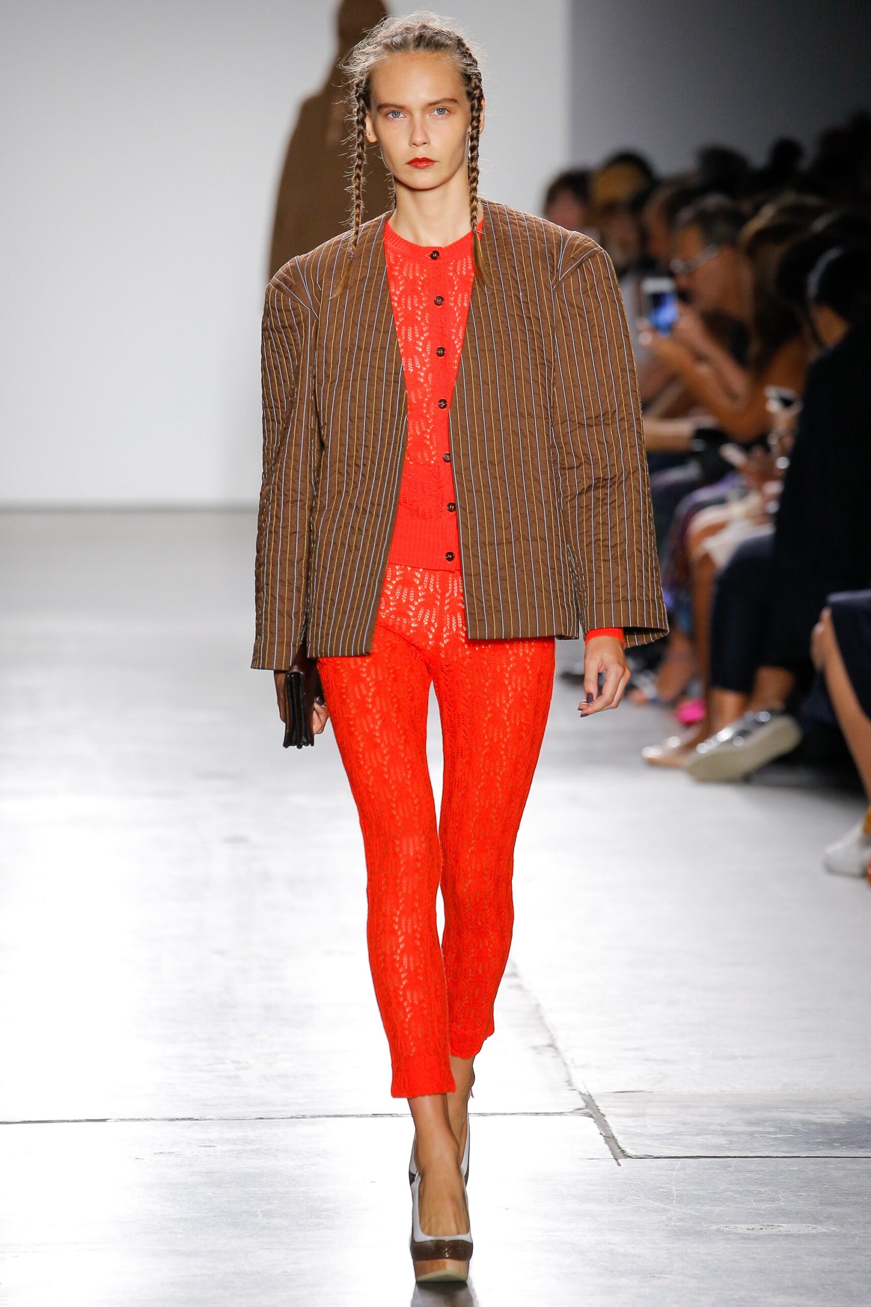 brown striped jacket and red pants