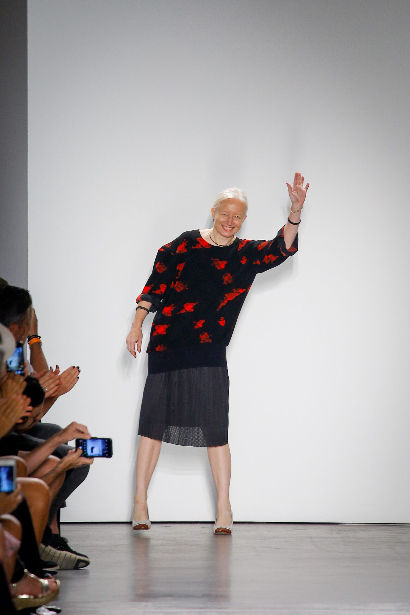 black and red printed top with pleated skirt