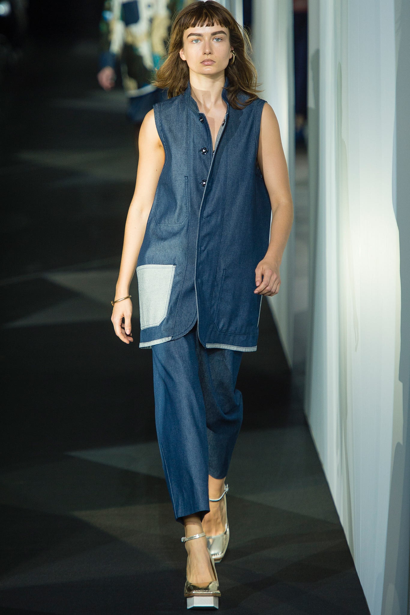 blue denim sleeveless collared relaxed buttoned pockets vest