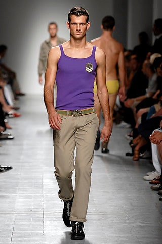 purple tank-top and beige pants