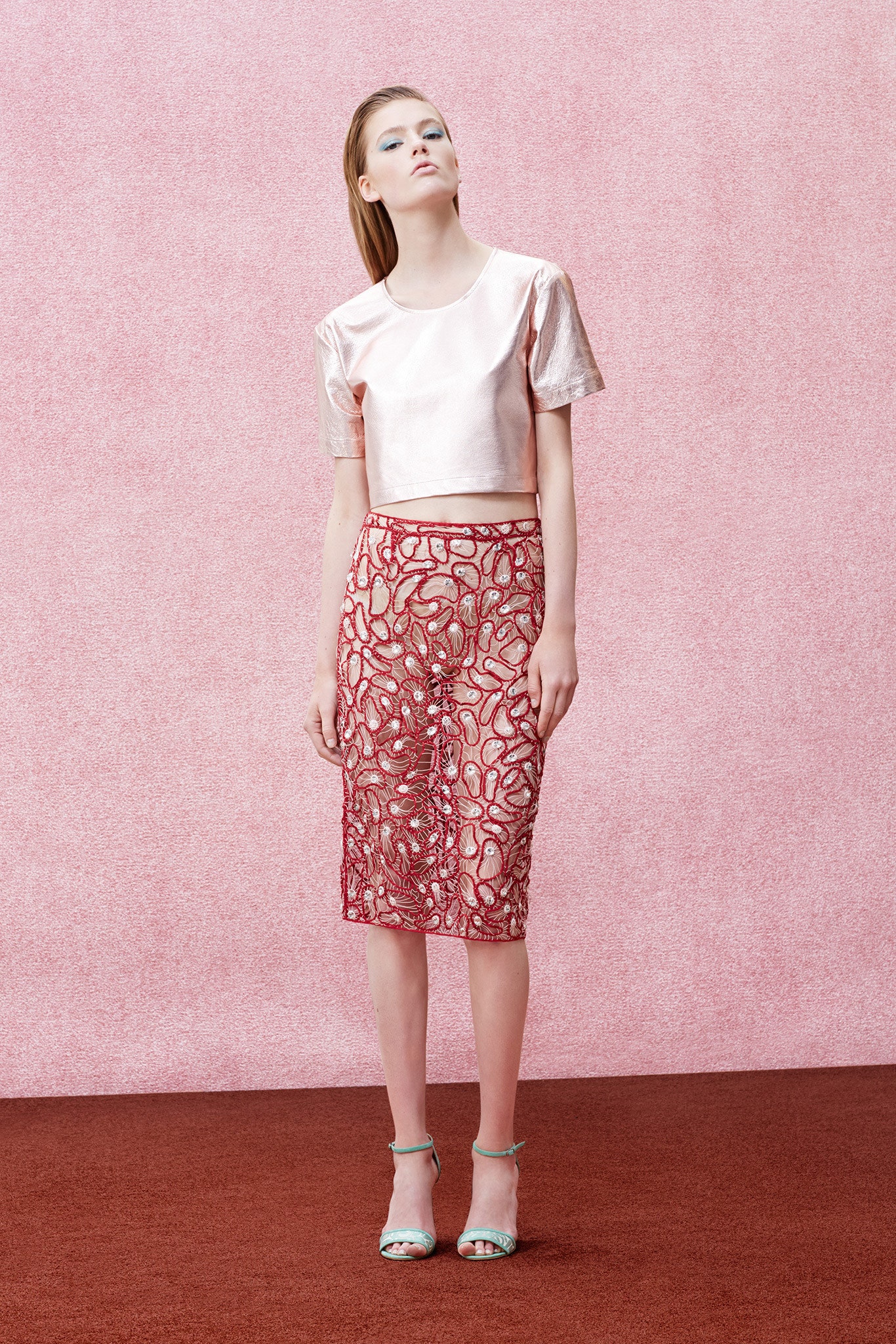 pink silk cropped top and red lace skirt