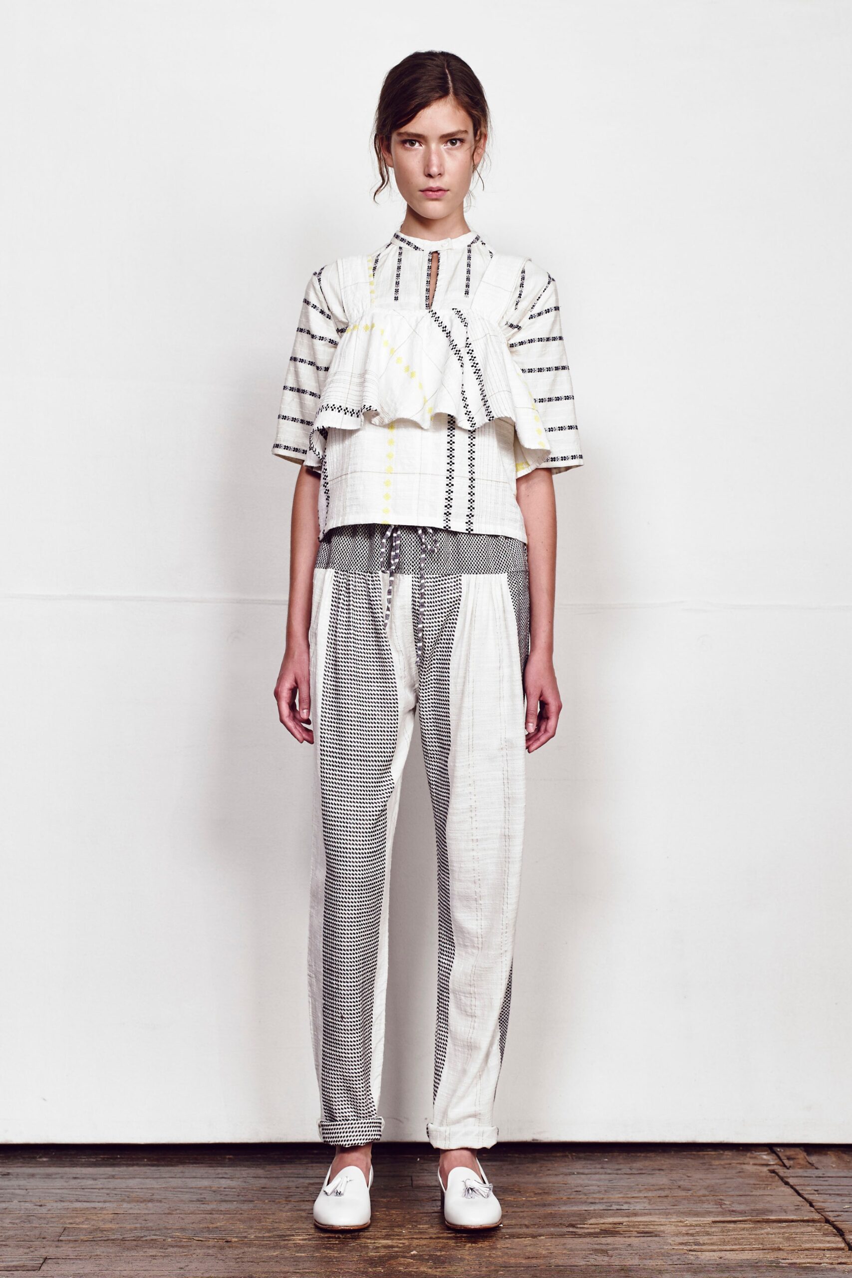 relaxed white and black top with checked pants
