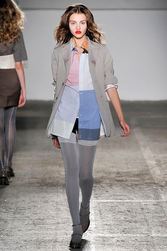 gray collared shirt with black shorts