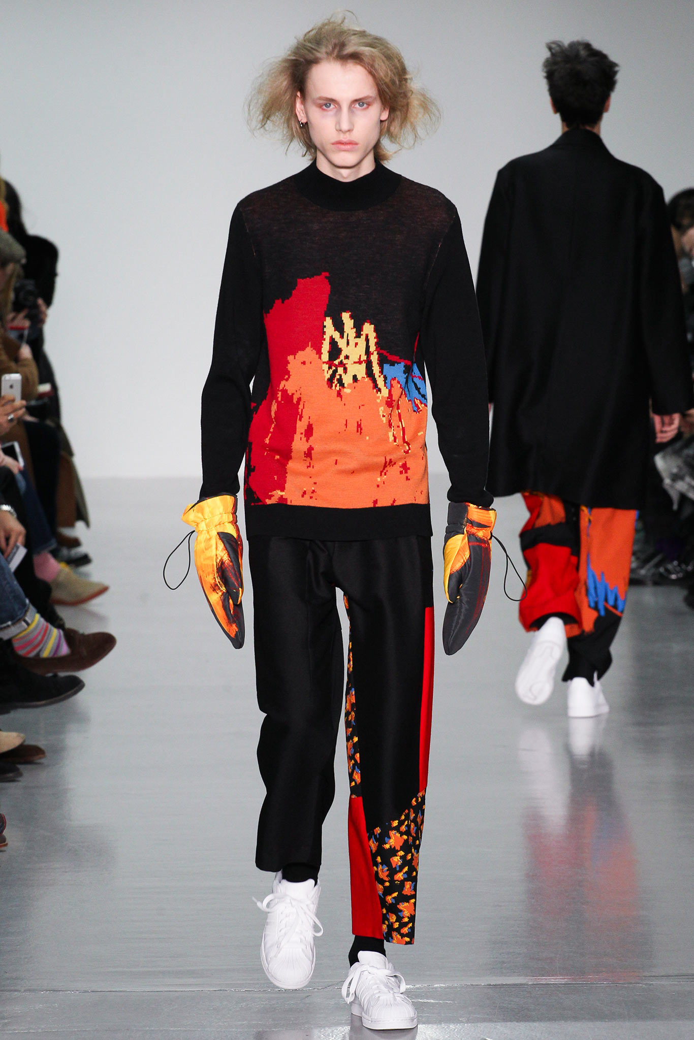 black and orange printed sweater with relaxed pants