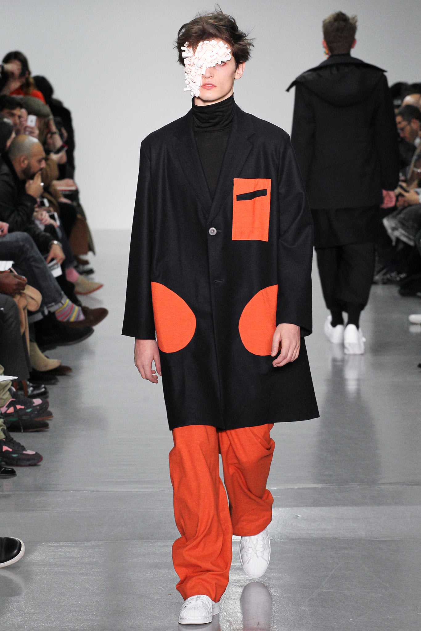 black coat with orange details