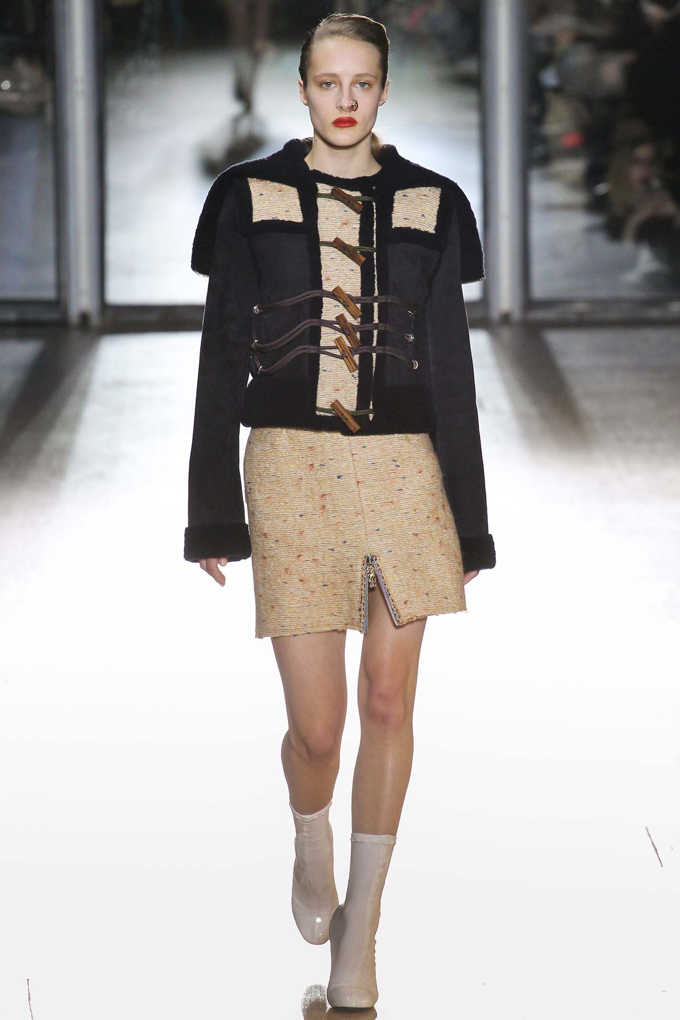 black fitted jacket beige mini skirt