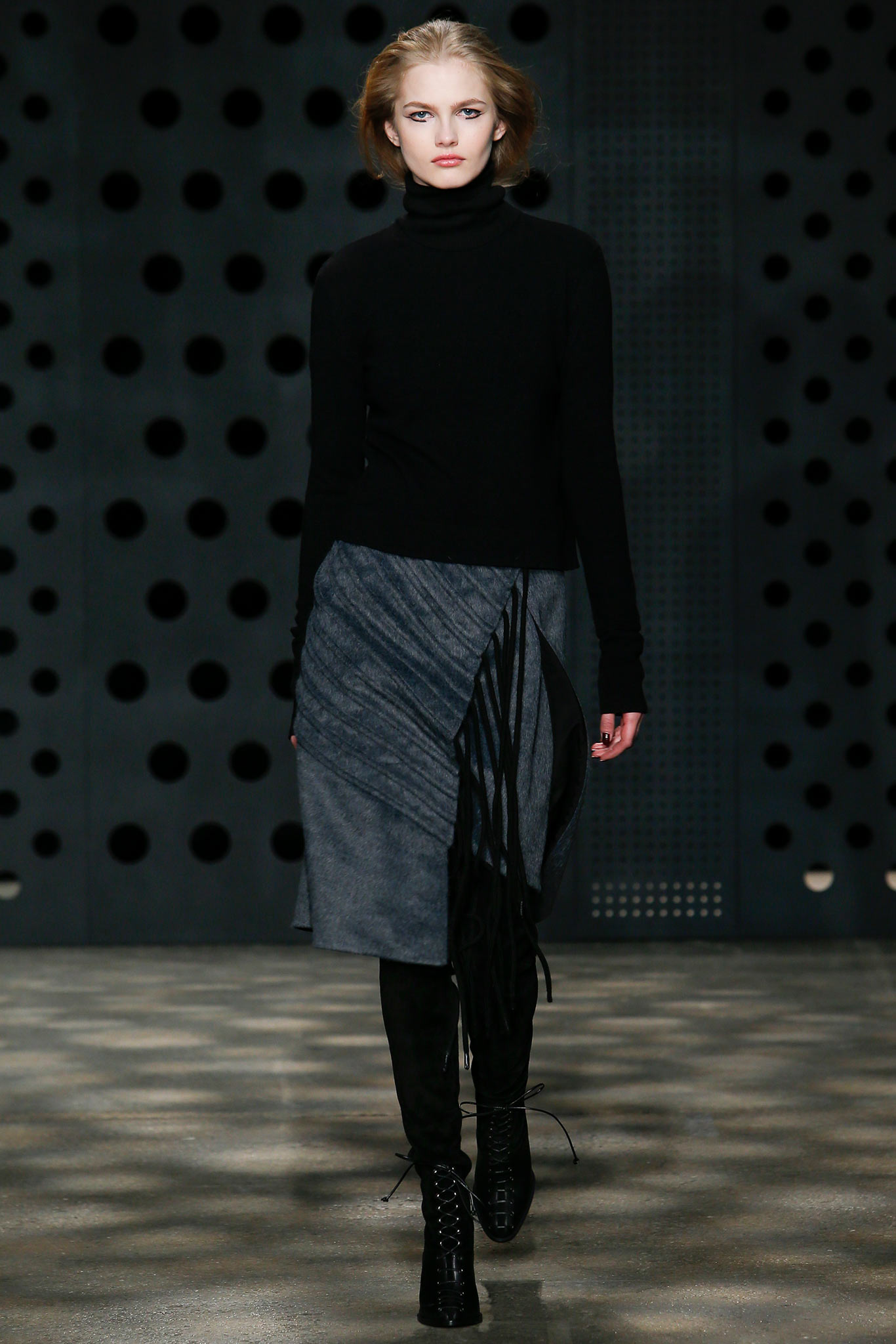 black fitted top with gray draped skirt