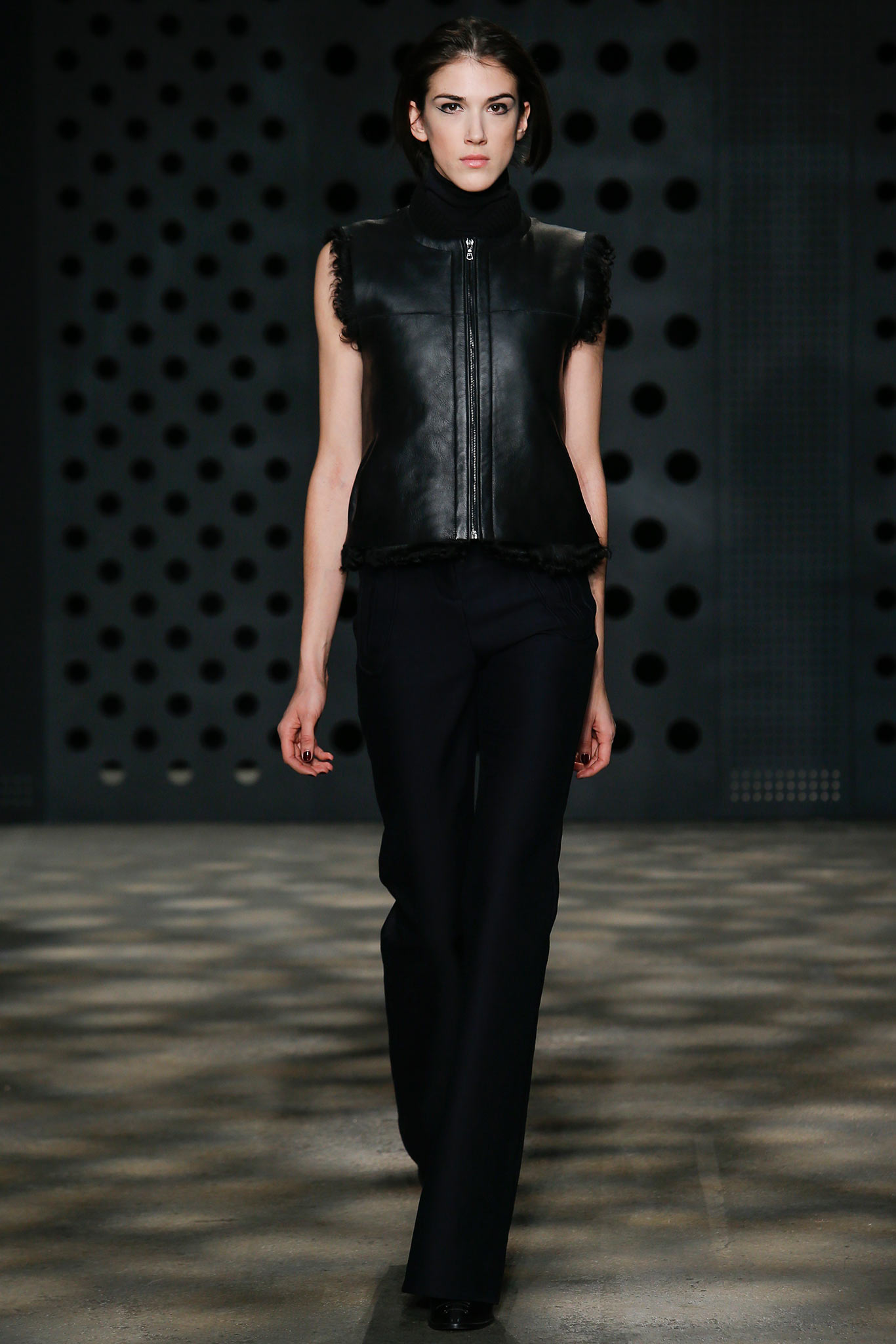 black leather fitted vest and tailored pants