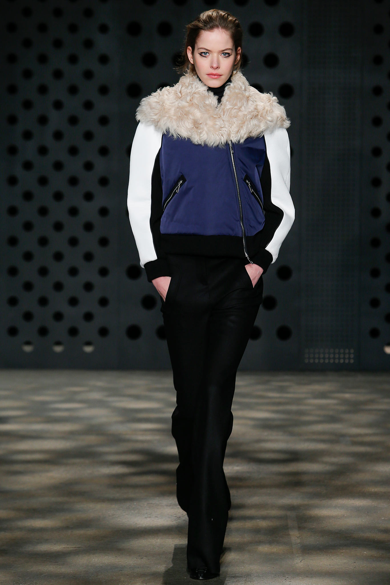 fitted blue jacket and black pants