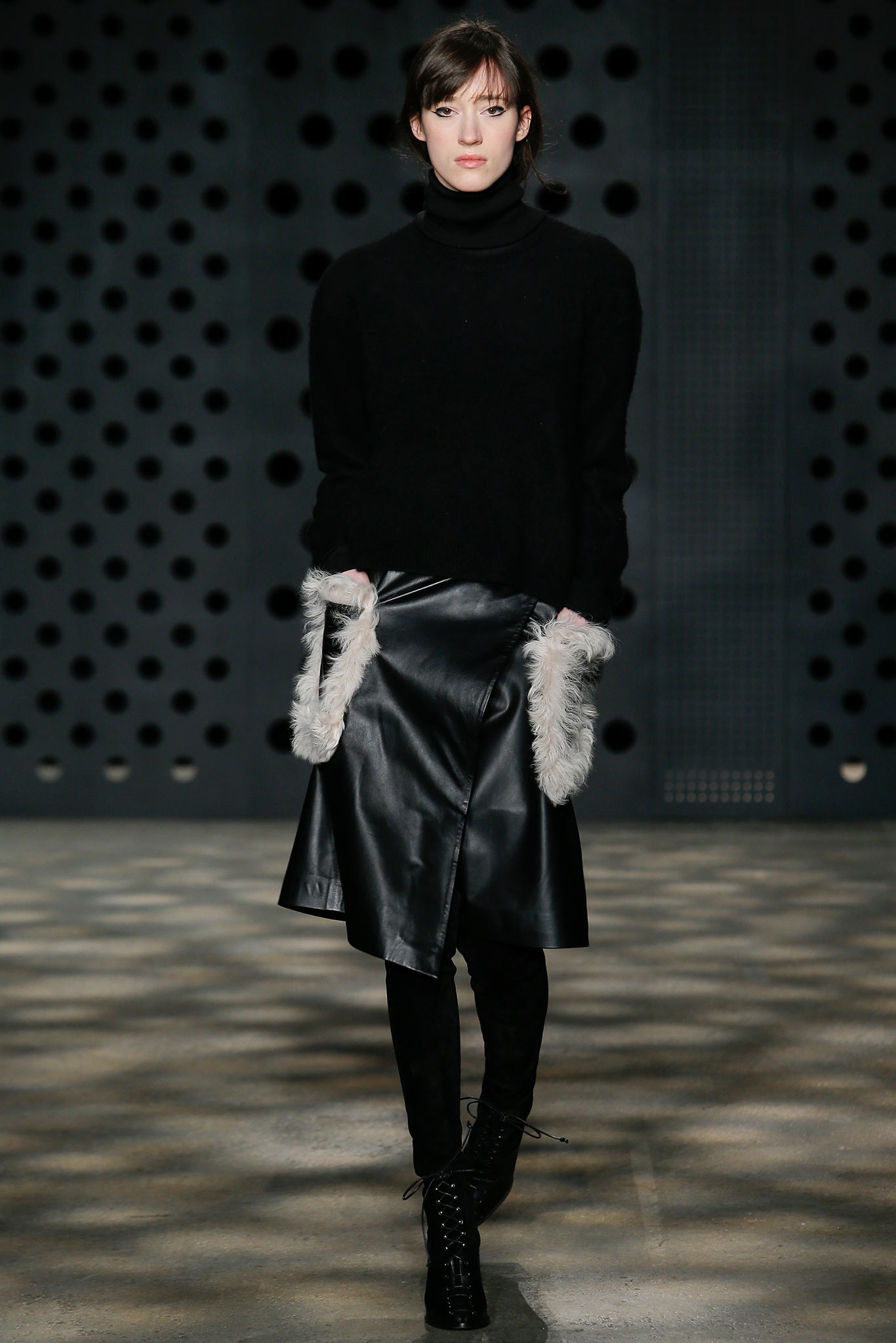 black wool sweater and leather skirt