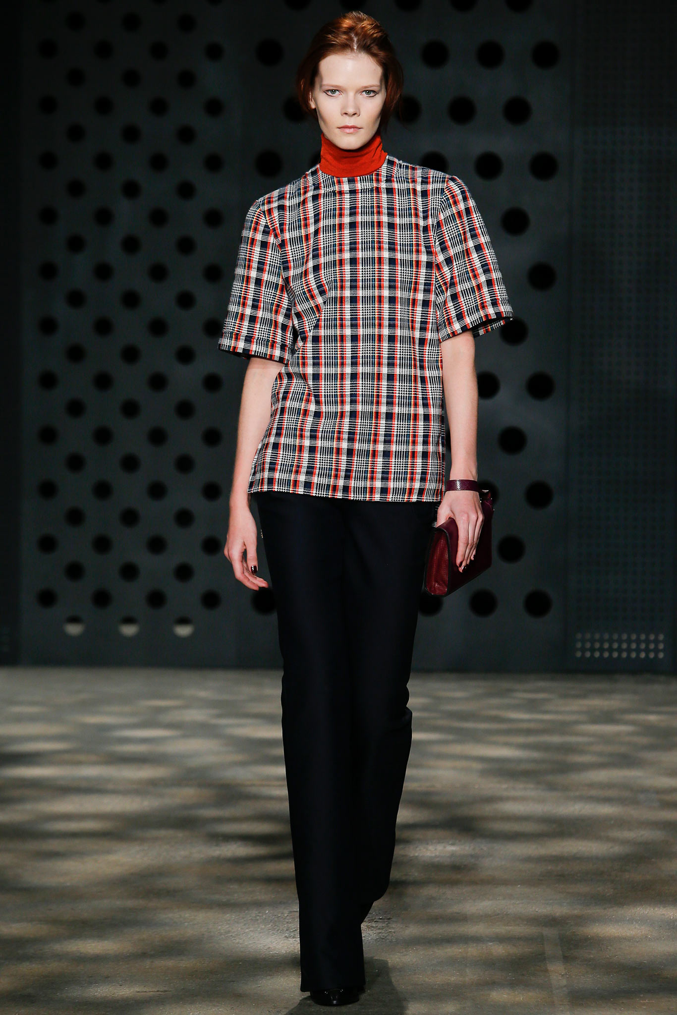 red checked top with black pants
