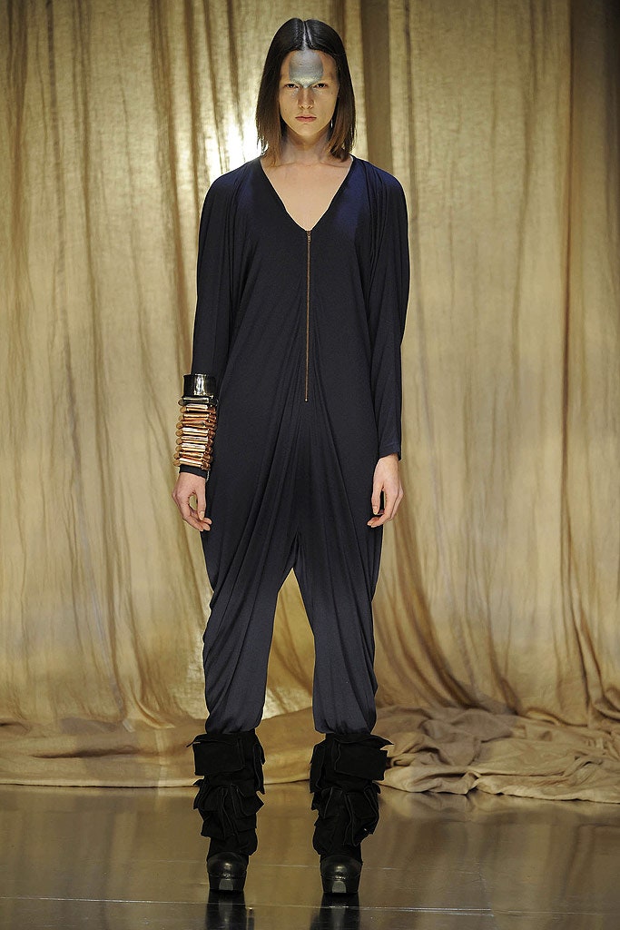 blue relaxed jumpsuit with ruffled boots