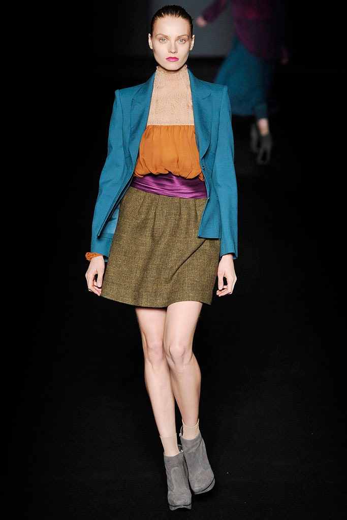 blue blazer orange top brown skirt