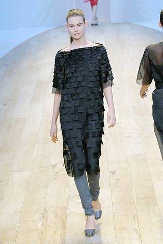 black layered top with gray pants