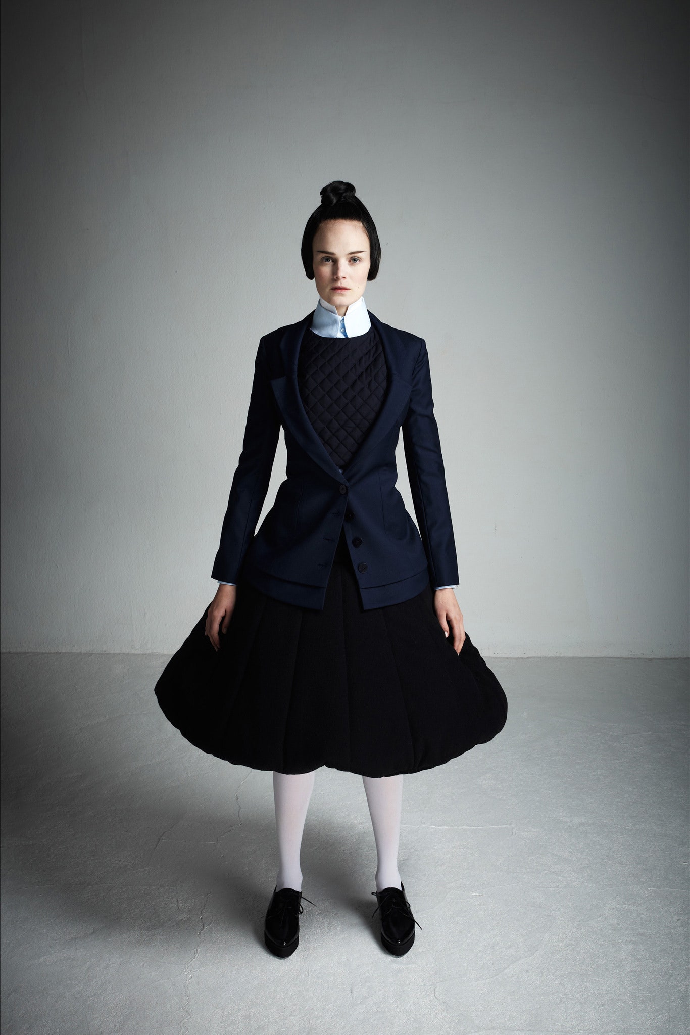 black tailored blazer with flared skirt