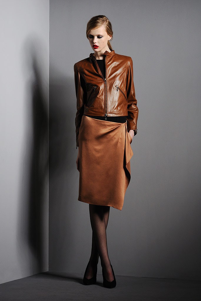 brown leather fitted jacket and tan silk skirt