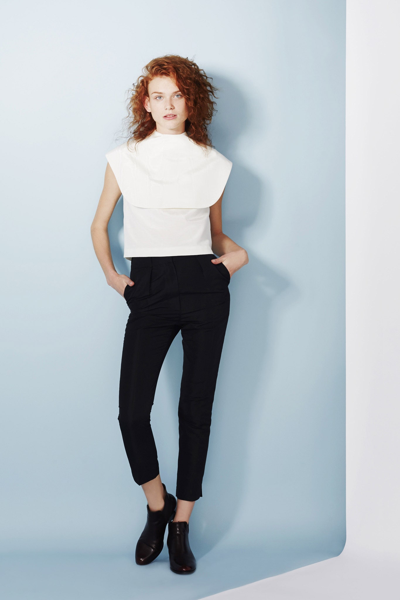 white cotton sleeveless high-neck fitted structured top