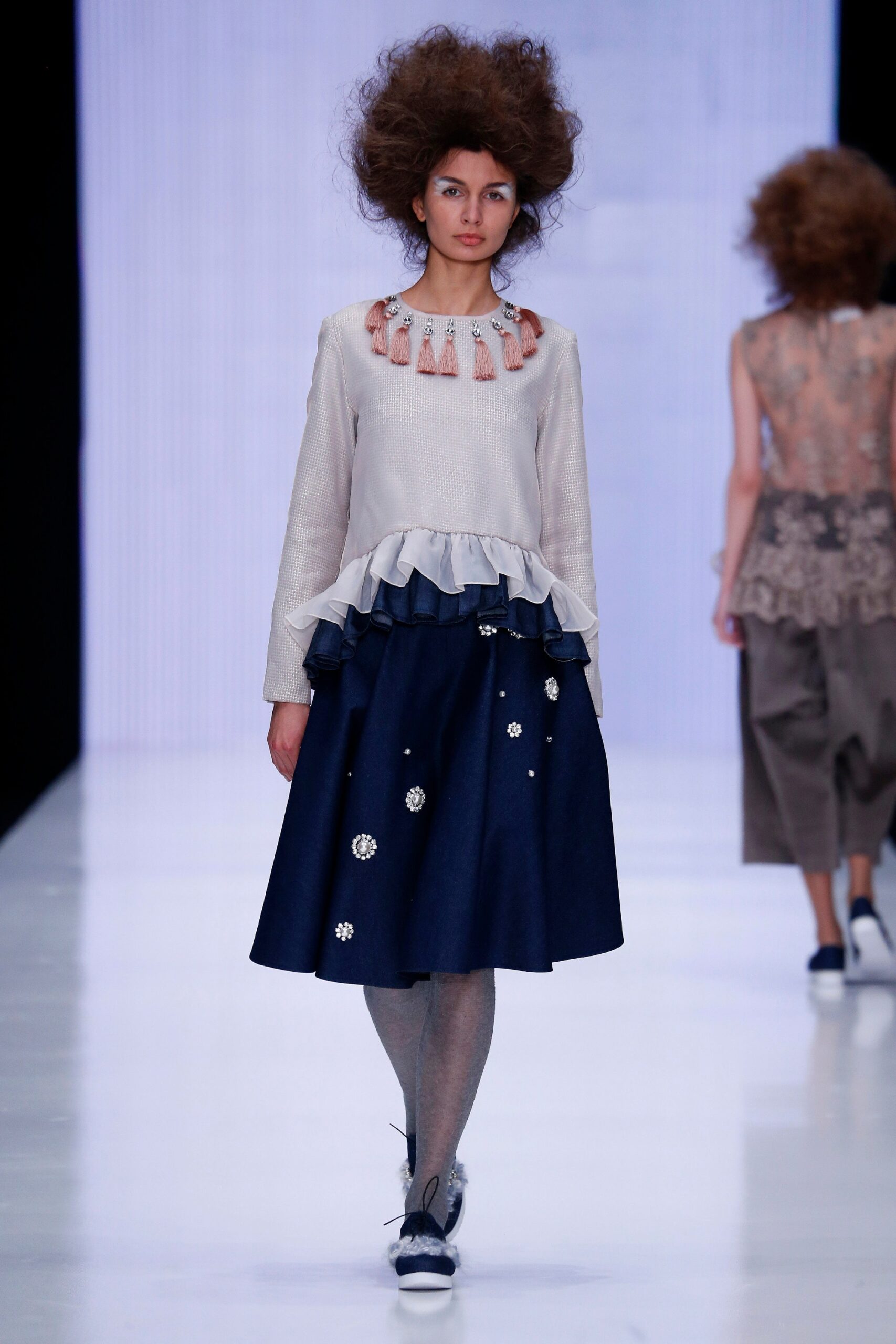 white ruffled top with blue skirt